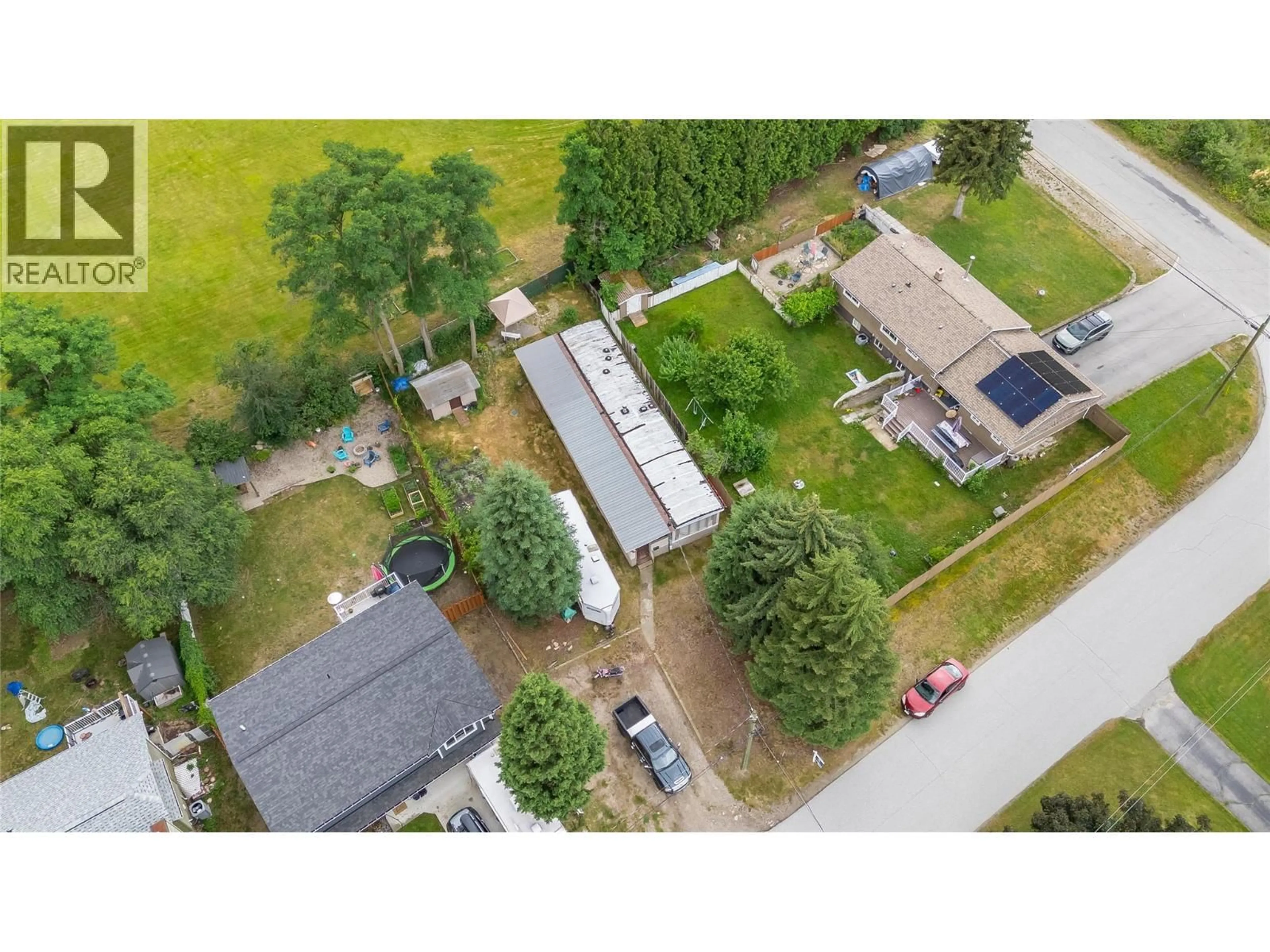 A pic from outside/outdoor area/front of a property/back of a property/a pic from drone, street for 304 103 STREET, Castlegar British Columbia V1N3G2