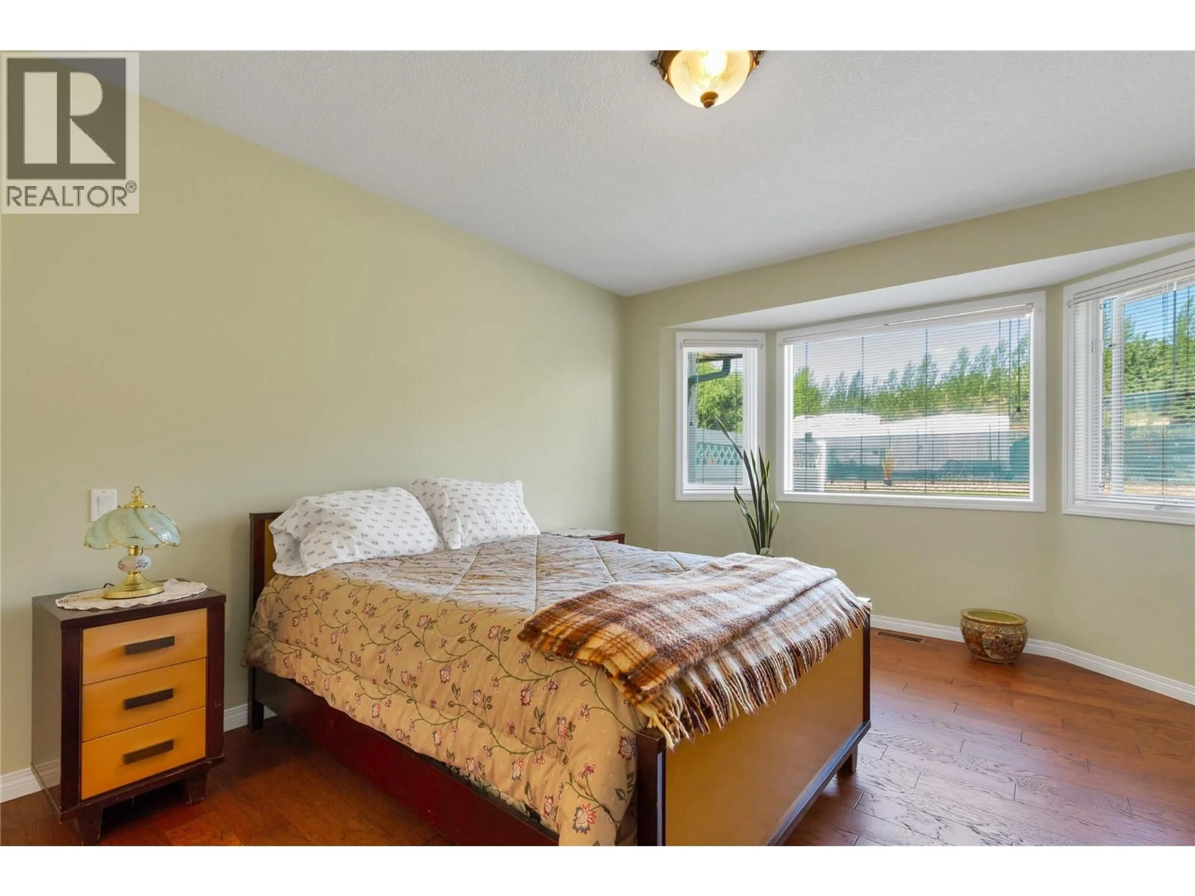 Bedroom with bed, wood/laminate floor for 16 - 2710 ALLENBY WAY, Vernon British Columbia V1T9P2