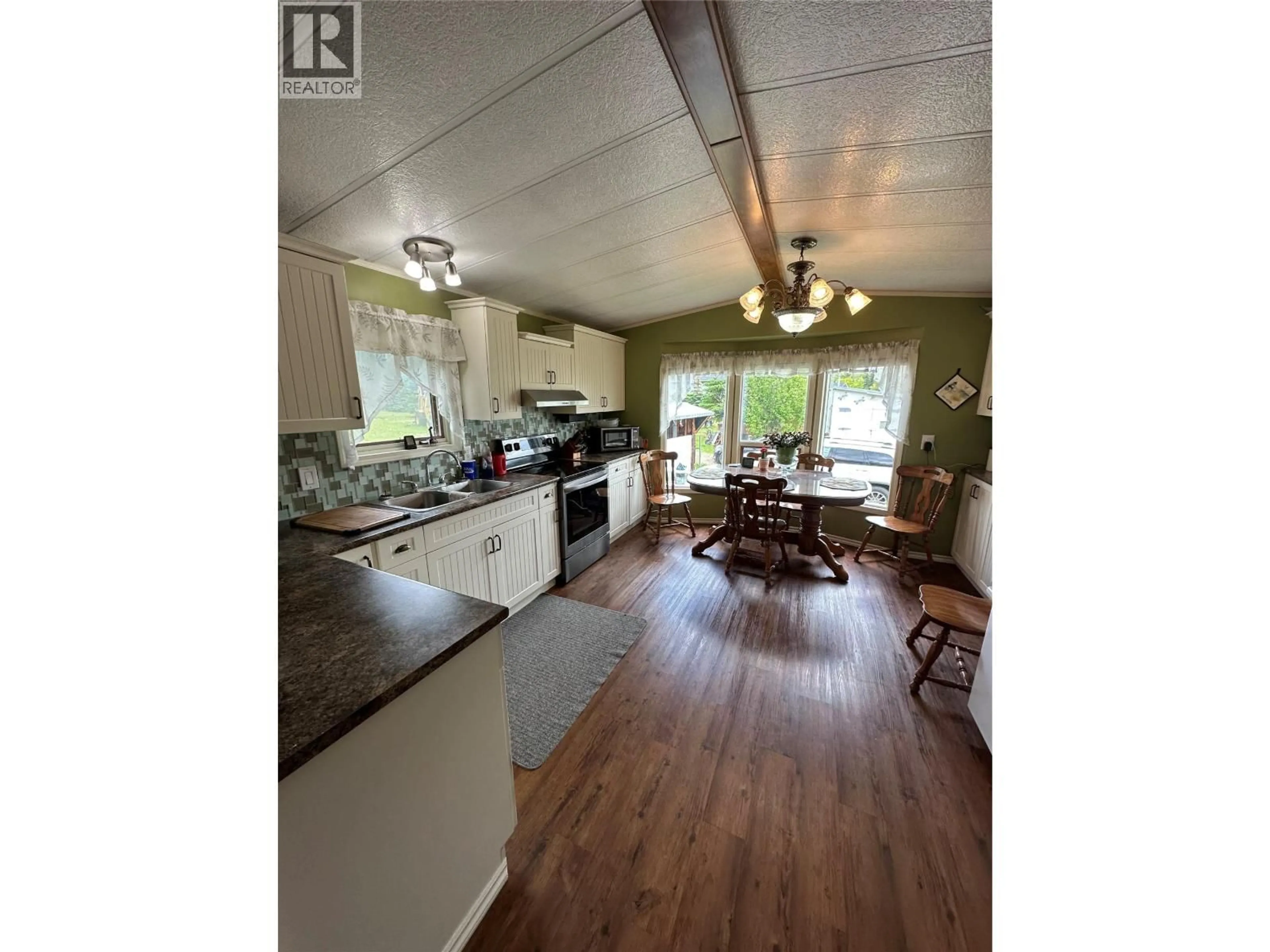 Open concept kitchen, wood/laminate floor for 2118 GUILLET OTHER, Chetwynd British Columbia V0C1J0