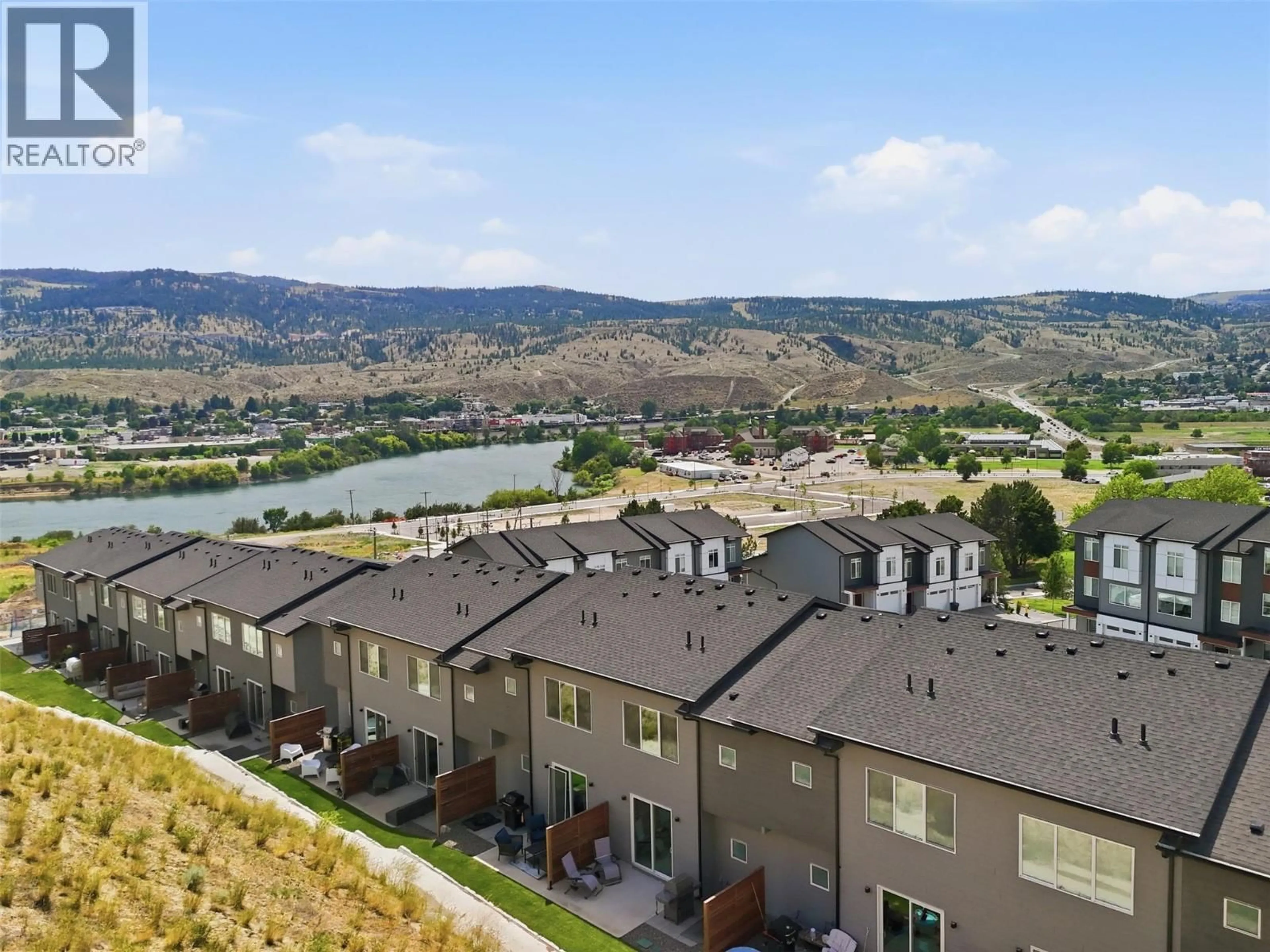 A pic from outside/outdoor area/front of a property/back of a property/a pic from drone, water/lake/river/ocean view for 115 RIVER GATE DRIVE, Kamloops British Columbia V2H0E4