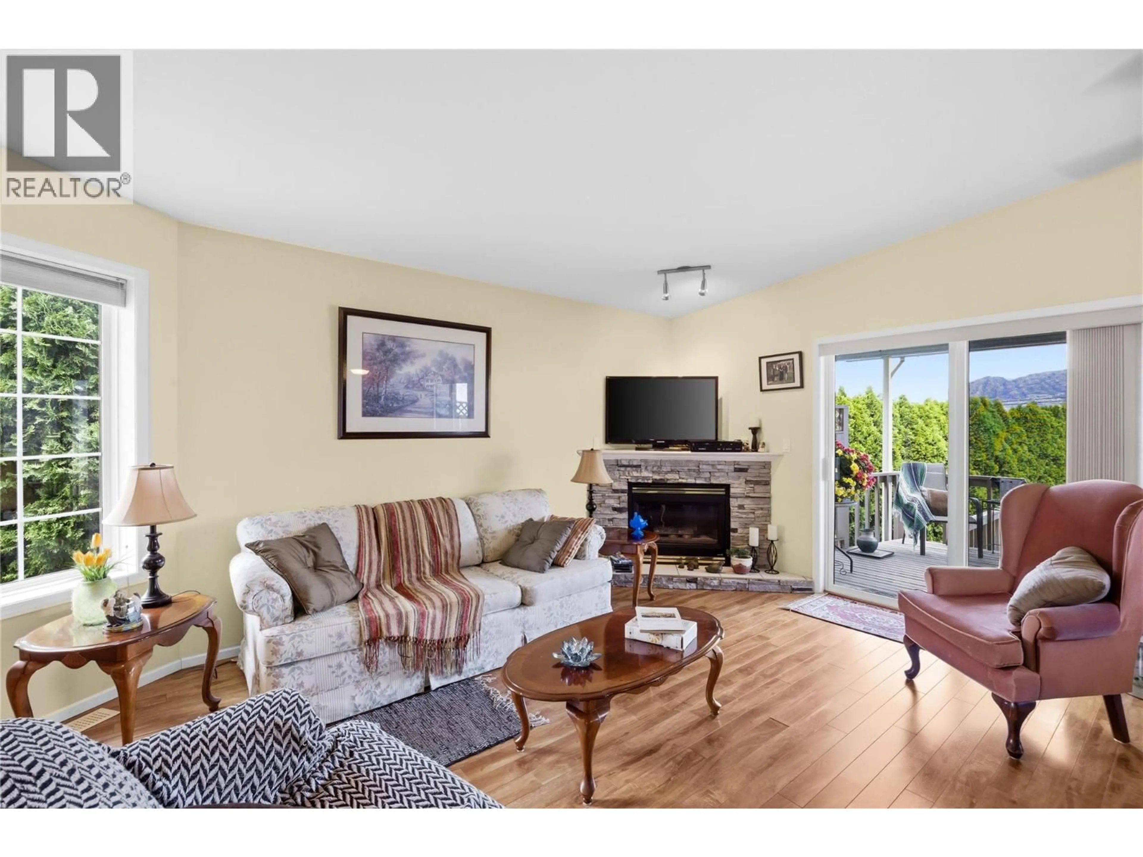 Living room with furniture, wood/laminate floor for 14 - 9400 115TH STREET, Osoyoos British Columbia V0H1V5