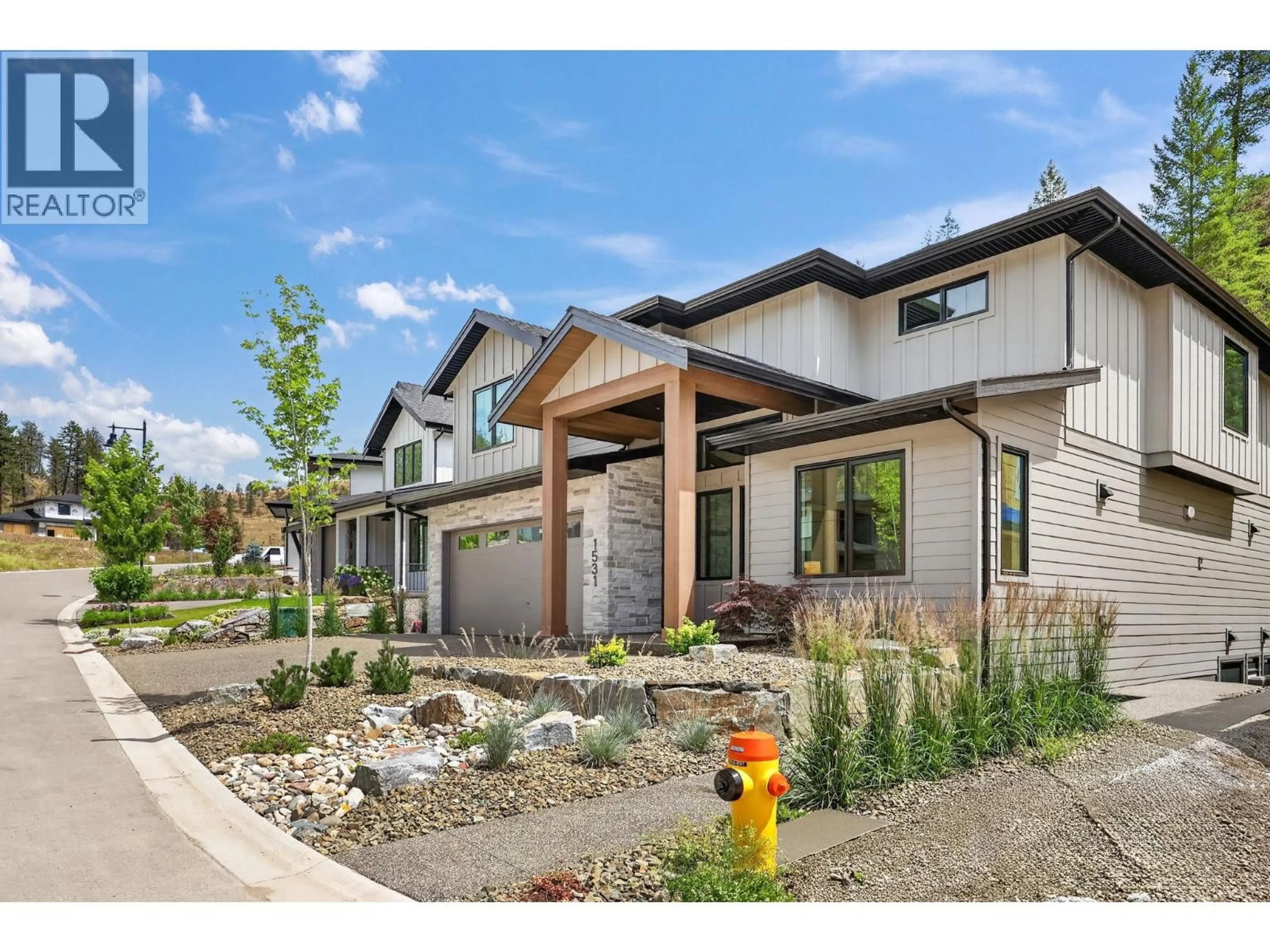 Home with brick exterior material, street for 1531 OLIVE POND PLACE, Kelowna British Columbia V1V2C6