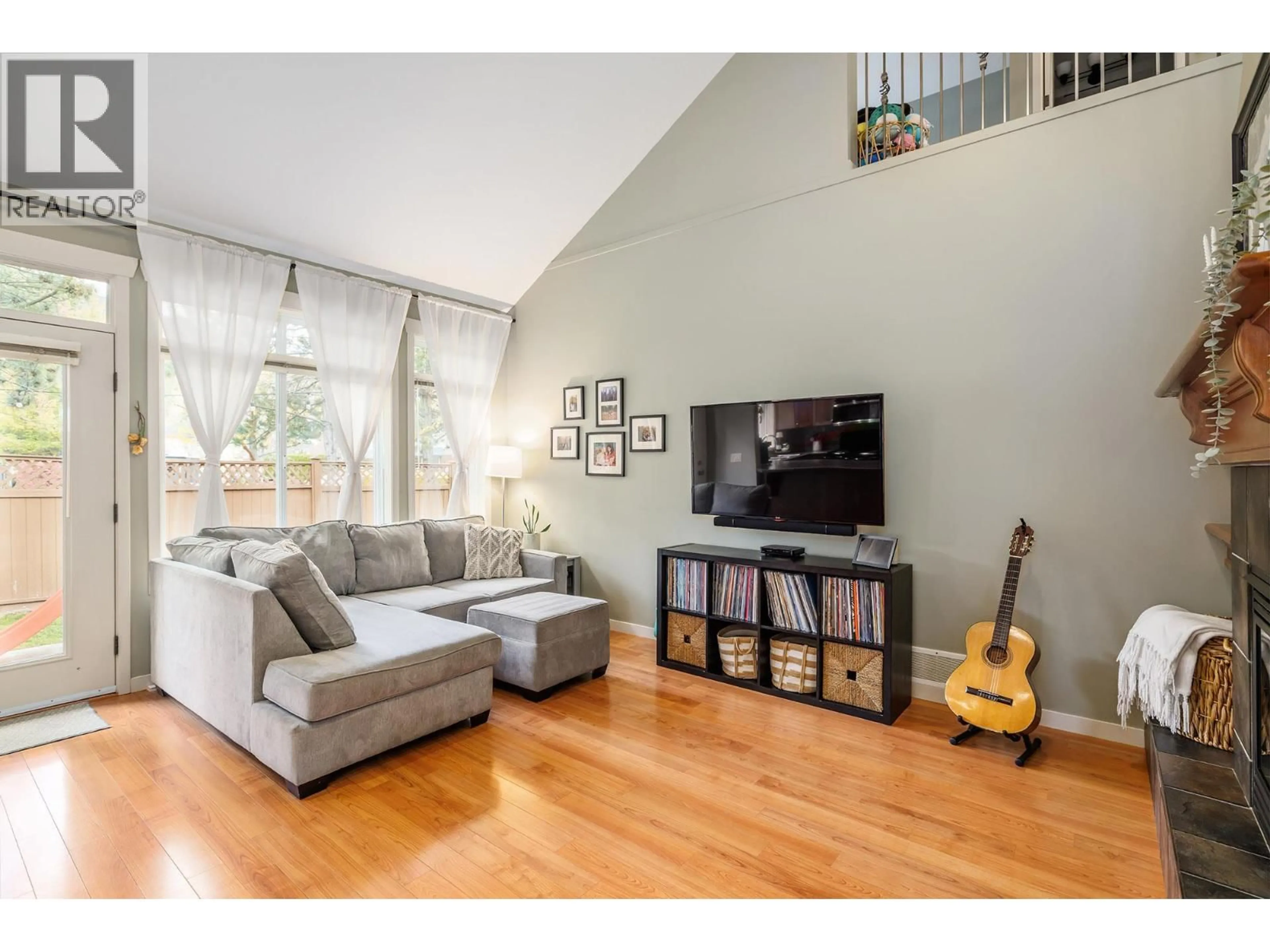 Living room with furniture, wood/laminate floor for 10 - 1450 ROSE MEADOW DRIVE, West Kelowna British Columbia V1Z4A4