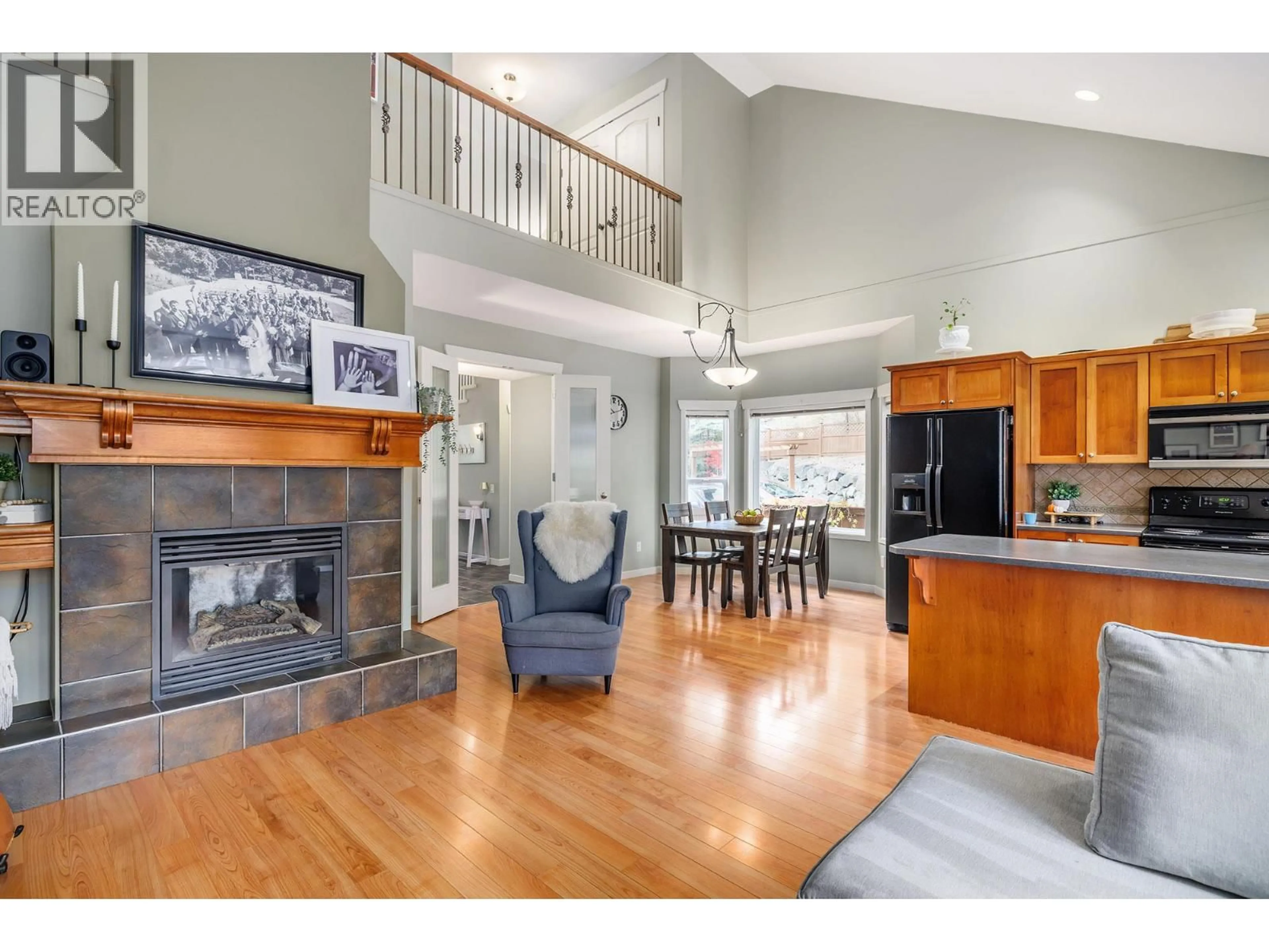 Open concept kitchen, wood/laminate floor for 10 - 1450 ROSE MEADOW DRIVE, West Kelowna British Columbia V1Z4A4