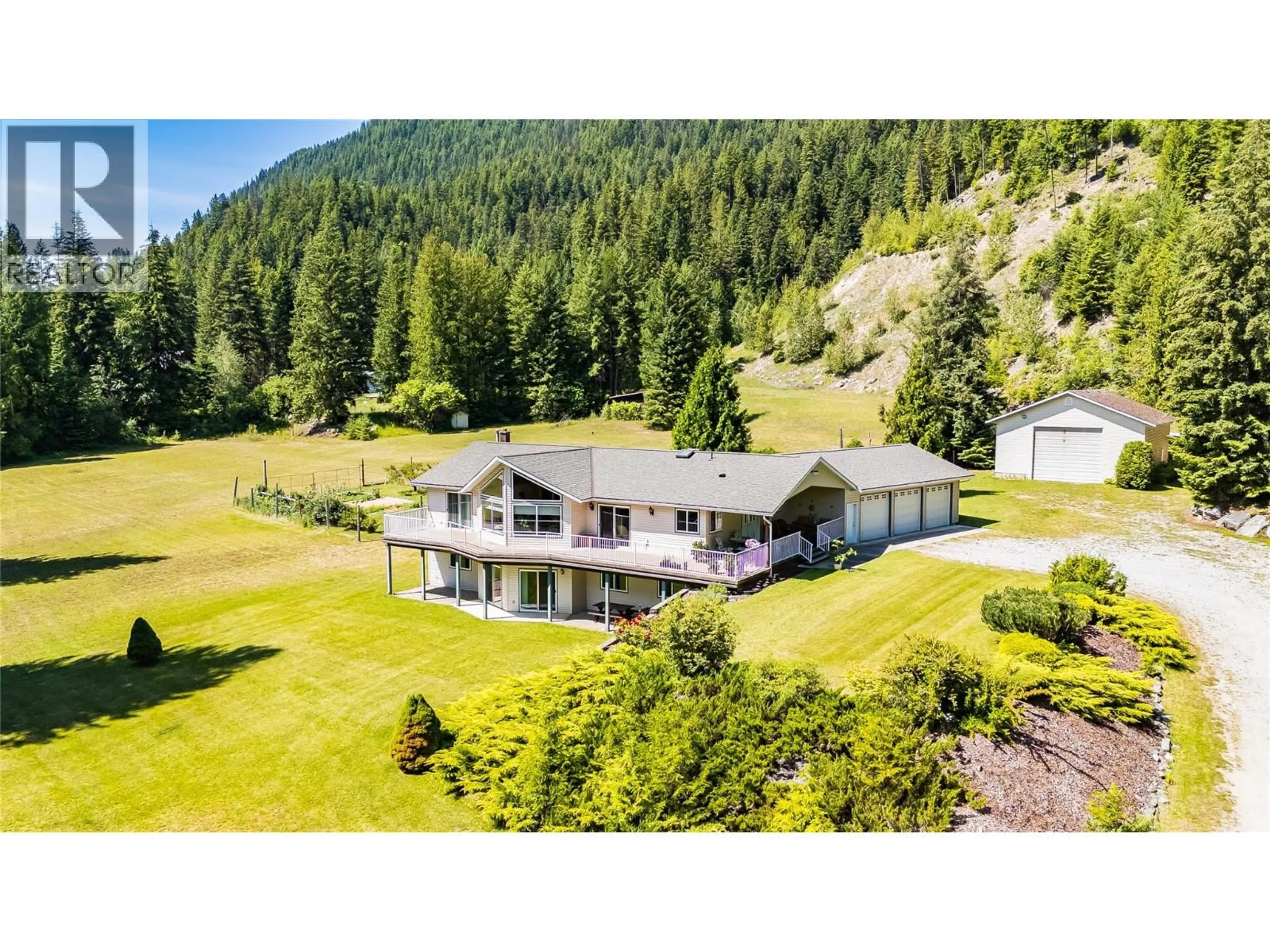 A pic from outside/outdoor area/front of a property/back of a property/a pic from drone, mountain view for 1995 LOFF ROAD, Castlegar British Columbia V1N4M9