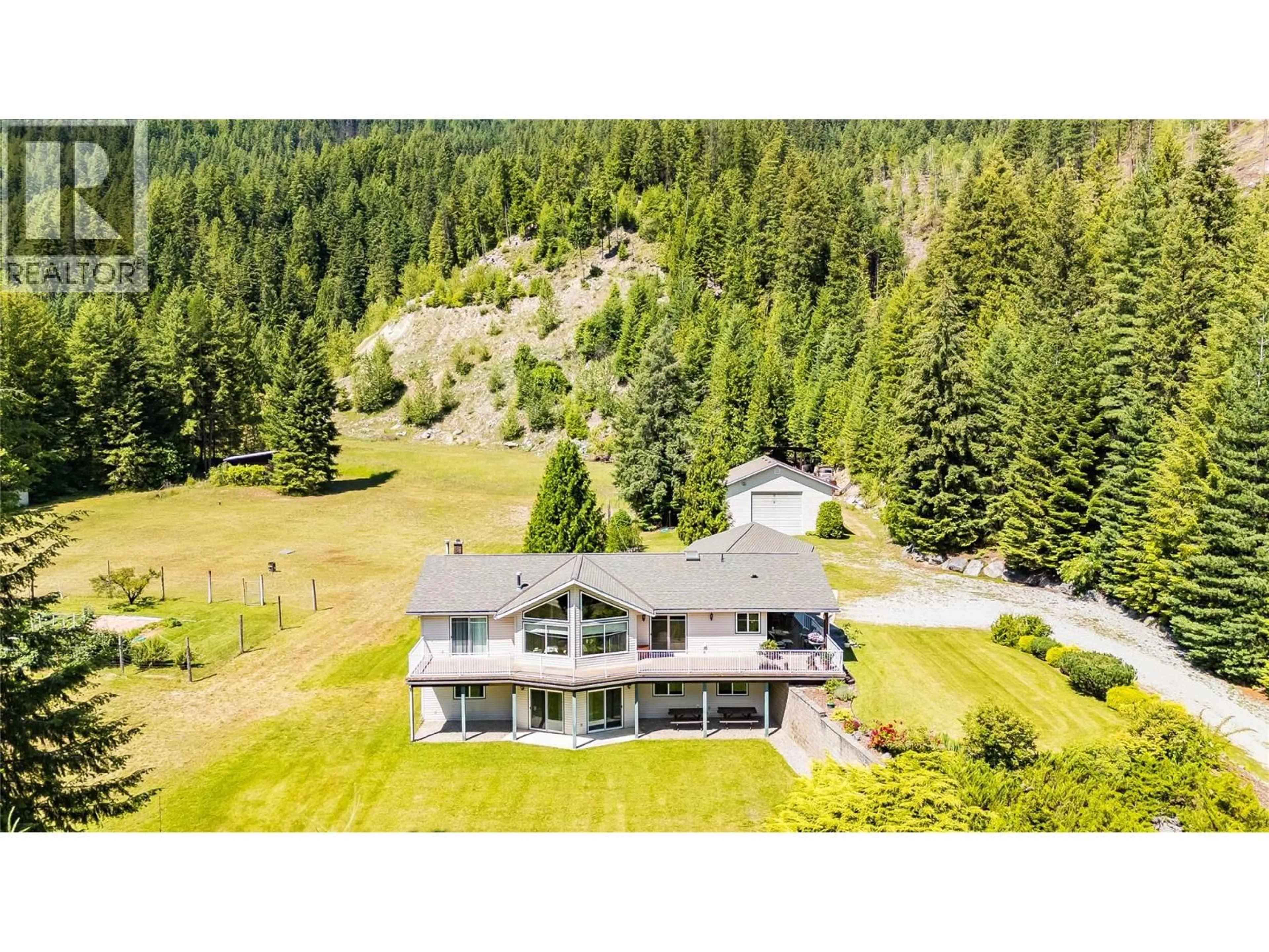A pic from outside/outdoor area/front of a property/back of a property/a pic from drone, mountain view for 1995 LOFF ROAD, Castlegar British Columbia V1N4M9