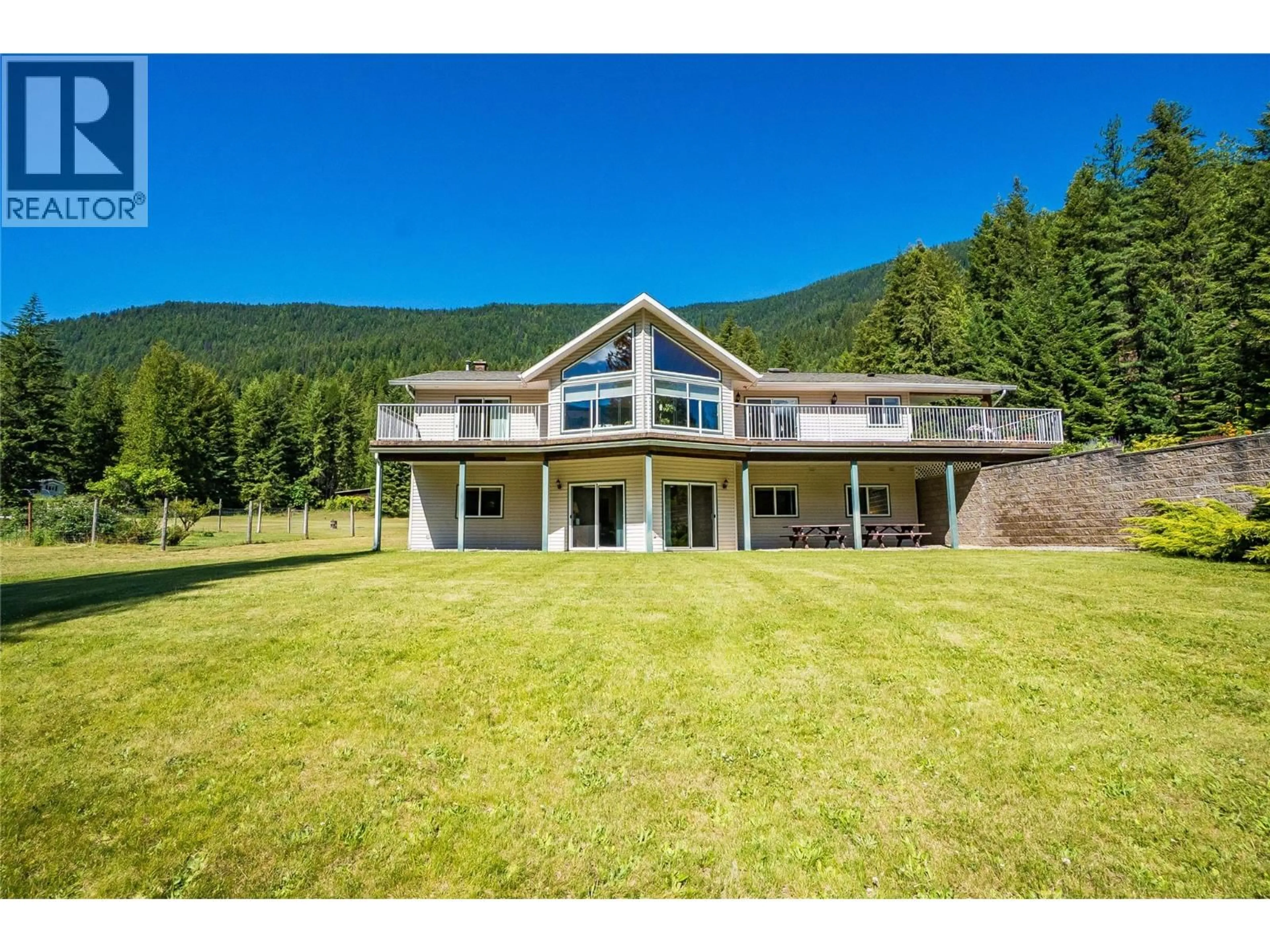 A pic from outside/outdoor area/front of a property/back of a property/a pic from drone, mountain view for 1995 LOFF ROAD, Castlegar British Columbia V1N4M9