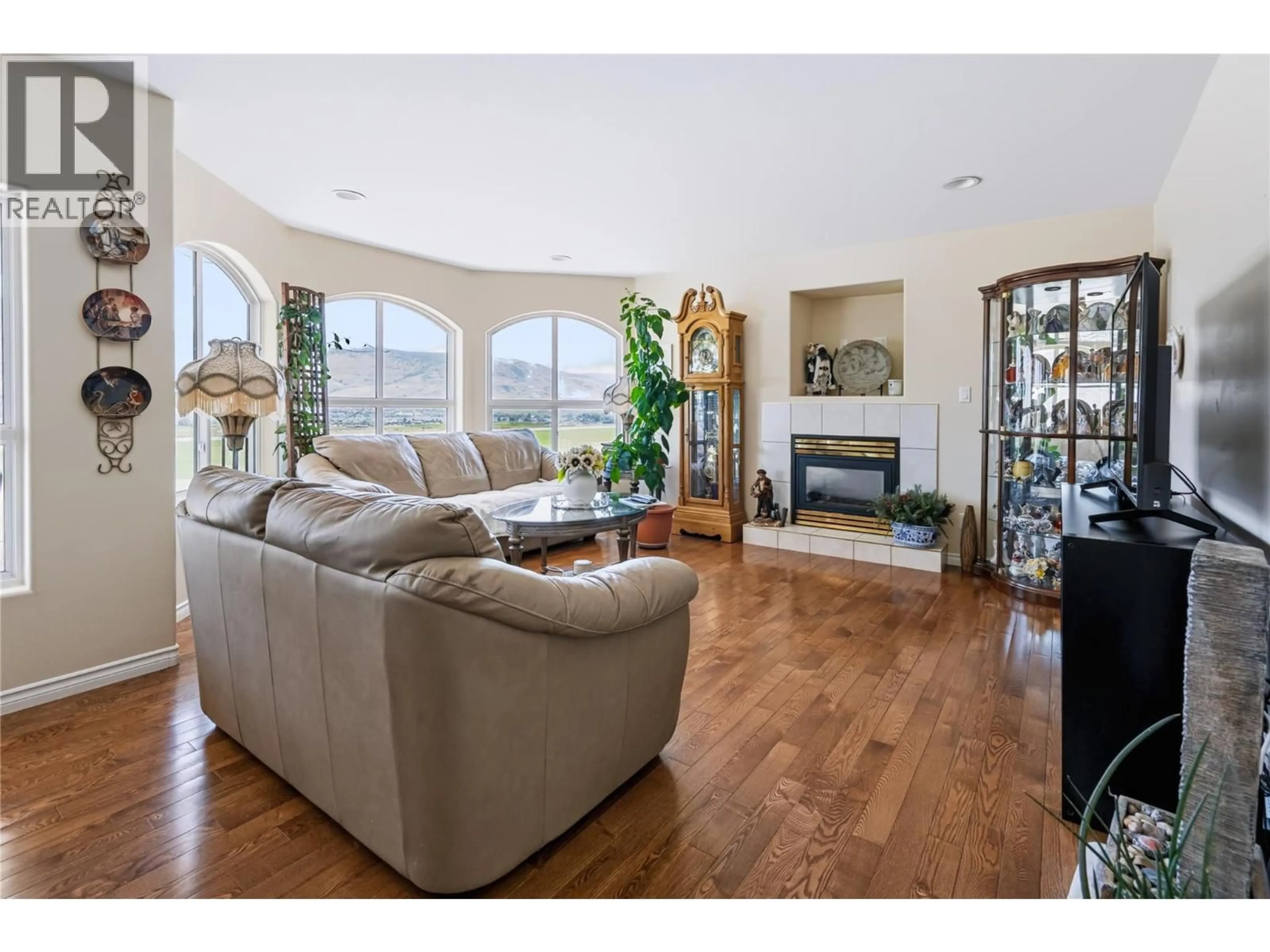 Living room with furniture, wood/laminate floor for 4206 GOLF COURSE DRIVE, Osoyoos British Columbia V0H1V4