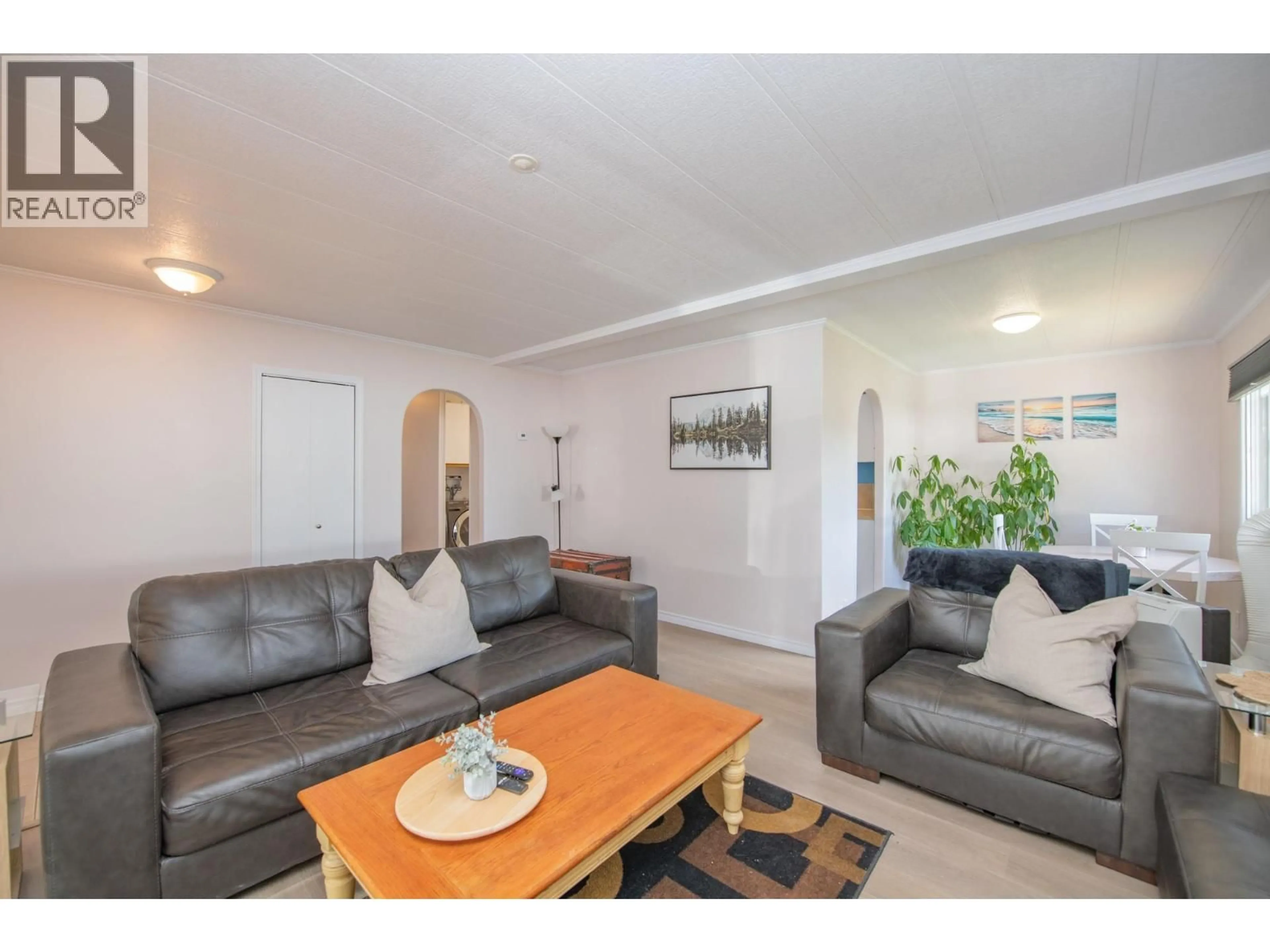 Living room with furniture, wood/laminate floor for 42 - 844 HUTLEY ROAD, Armstrong British Columbia V0E1B7