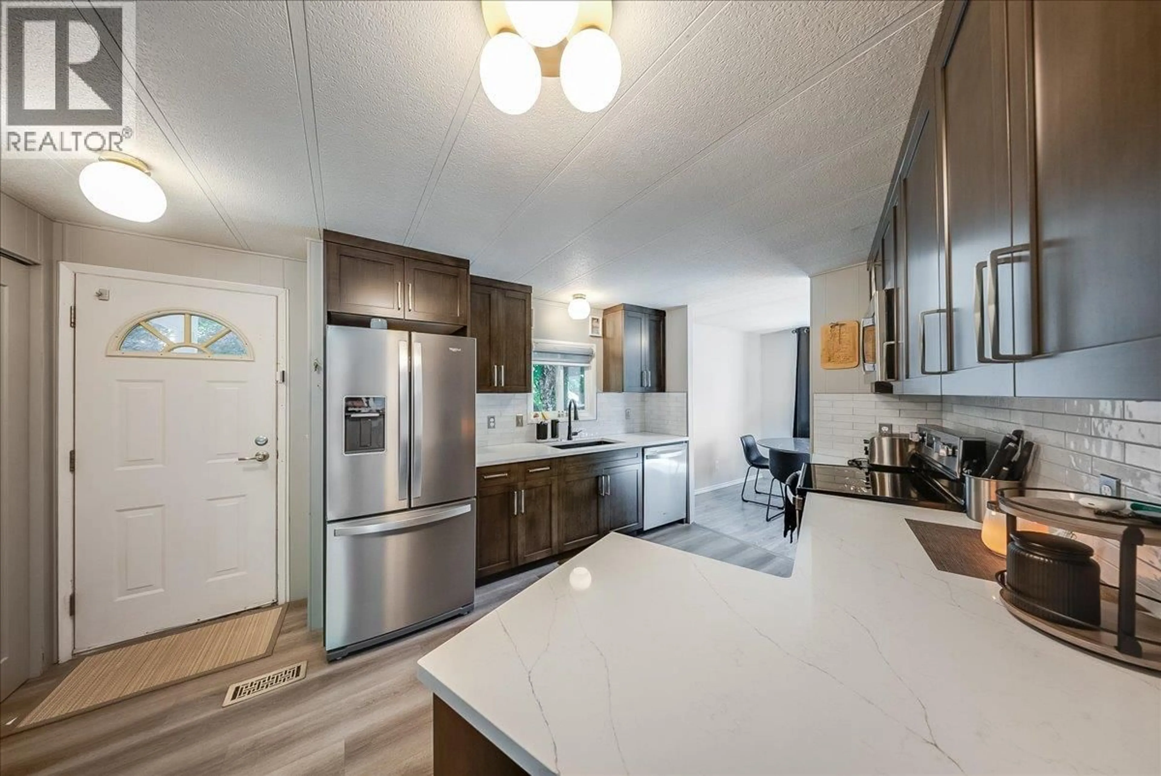 Open concept kitchen, ceramic/tile floor for 17 DAVIS AVENUE, Fruitvale British Columbia V0G1L0