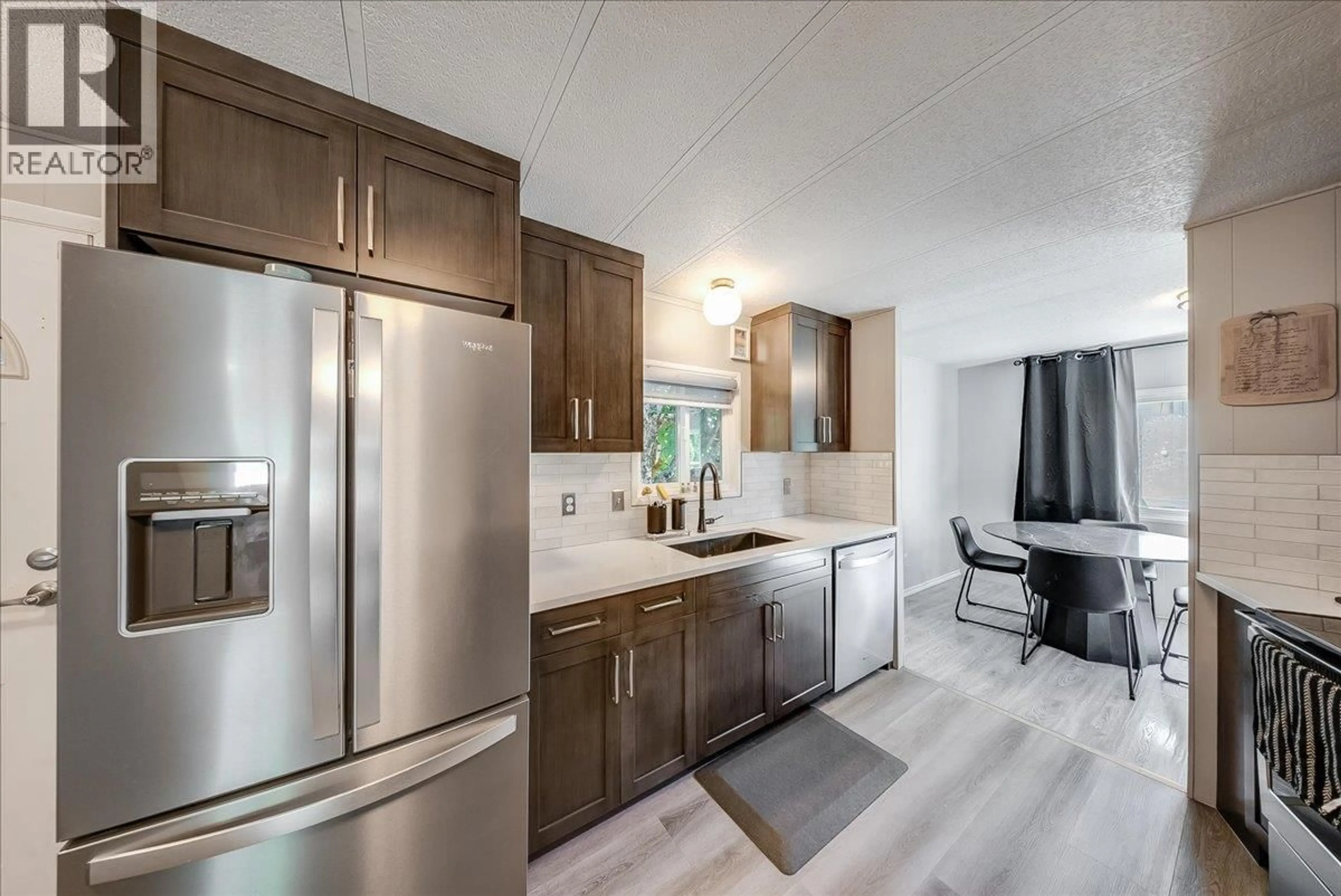 Open concept kitchen, ceramic/tile floor for 17 DAVIS AVENUE, Fruitvale British Columbia V0G1L0