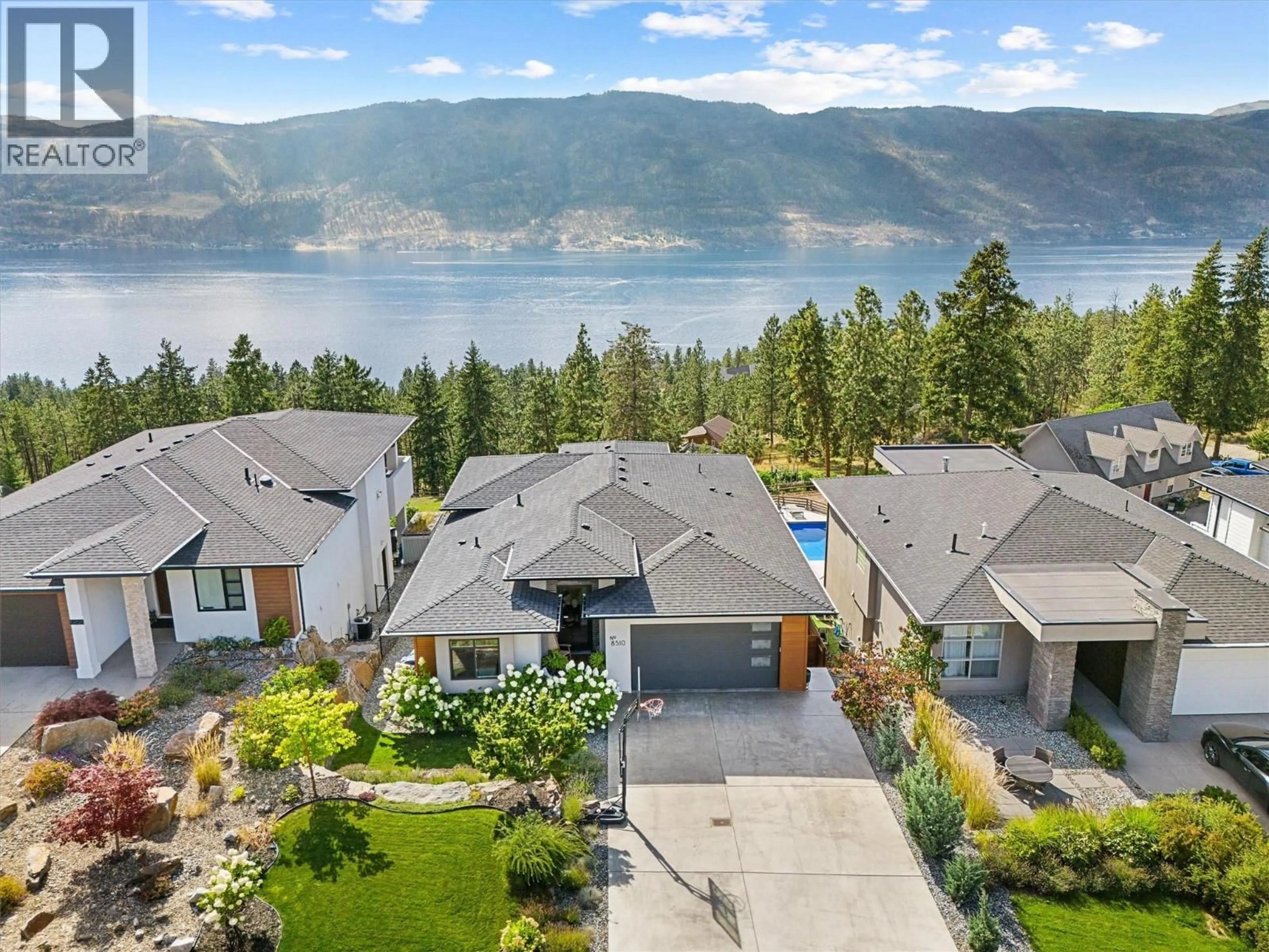 A pic from outside/outdoor area/front of a property/back of a property/a pic from drone, water/lake/river/ocean view for 8510 HERITAGE DRIVE, Lake Country British Columbia V4V2W2