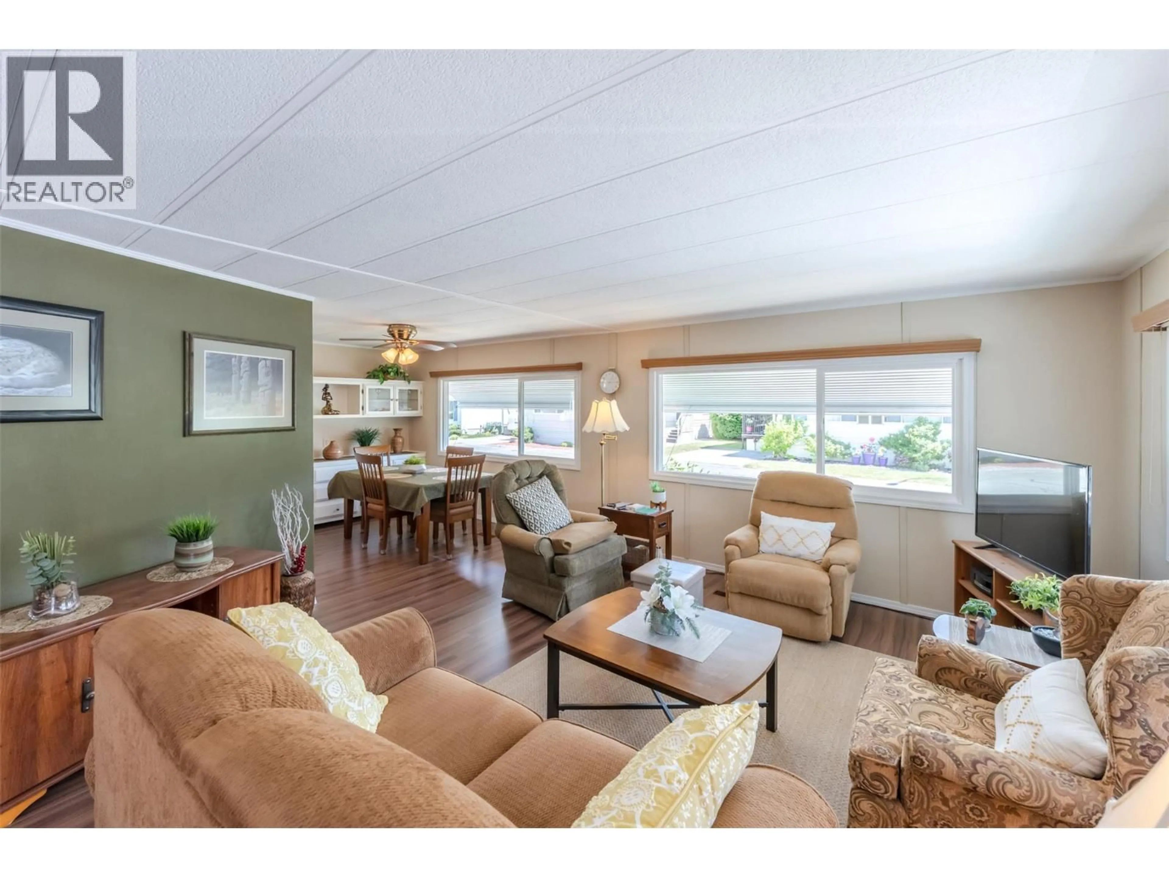 Living room with furniture, wood/laminate floor for 66 - 999 BURNABY AVENUE, Penticton British Columbia V2A1G7