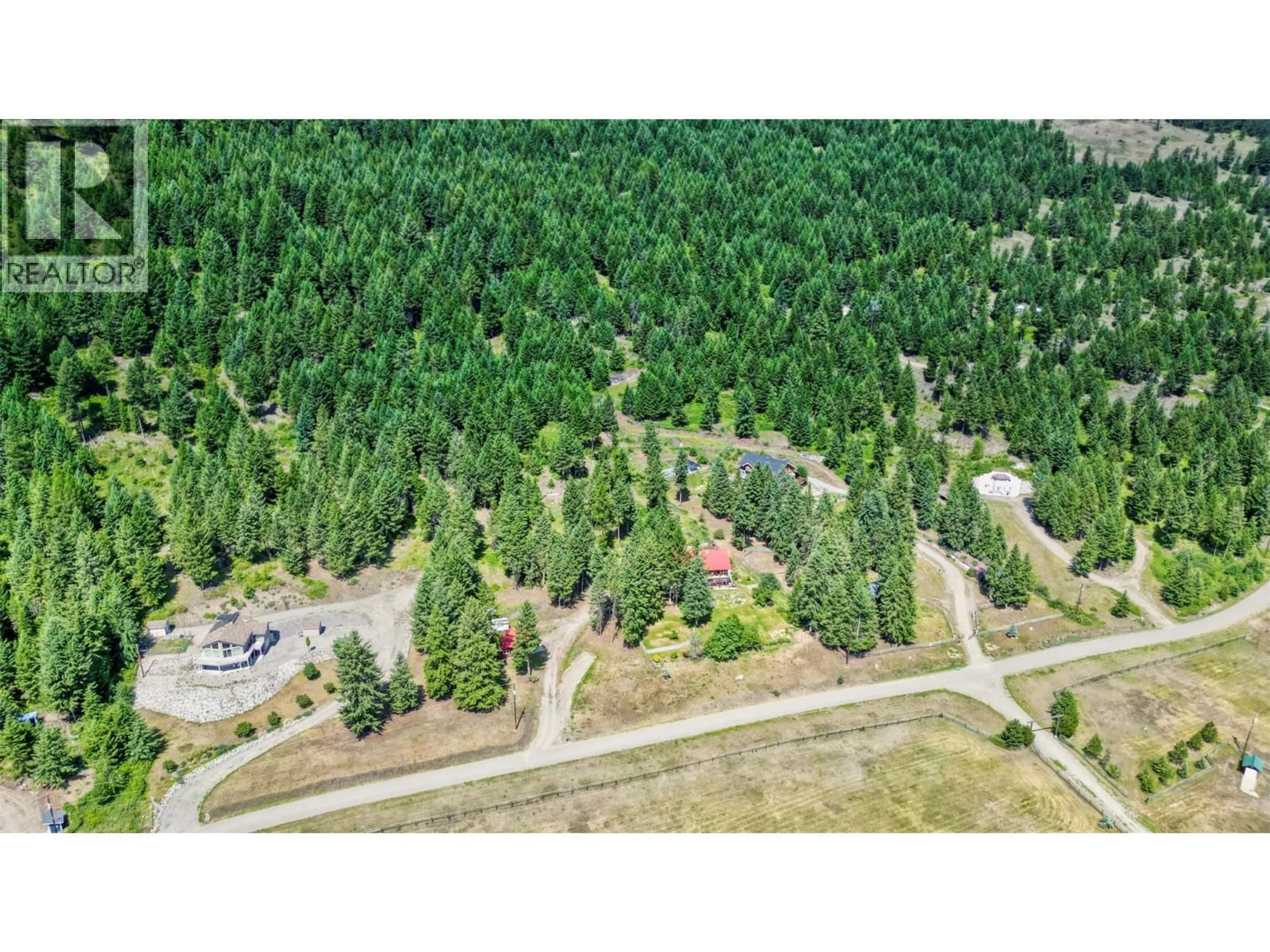 A pic from outside/outdoor area/front of a property/back of a property/a pic from drone, forest/trees view for 1845 HULME CREEK, Rock Creek British Columbia V0H1Y0