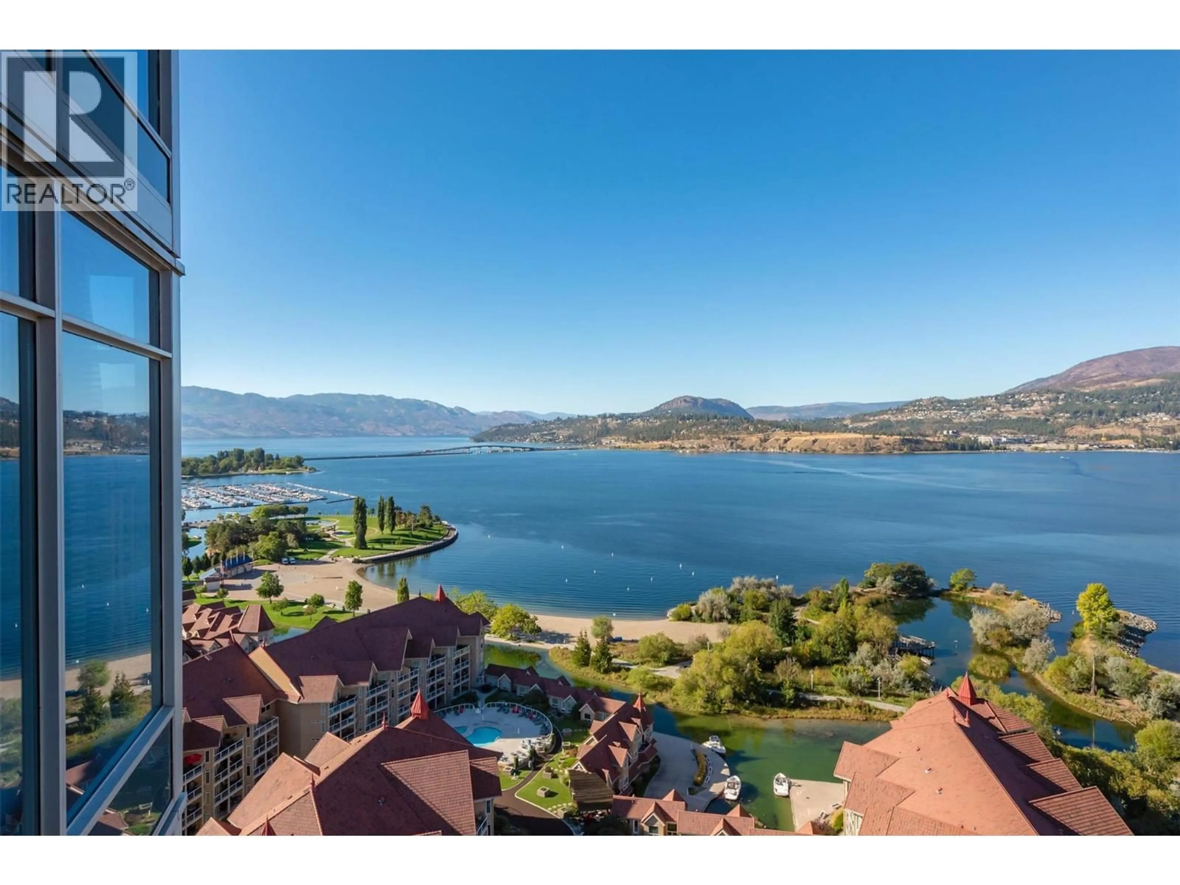 A pic from outside/outdoor area/front of a property/back of a property/a pic from drone, water/lake/river/ocean view for 2408 - 1075 SUNSET DRIVE, Kelowna British Columbia V1Y9Y9
