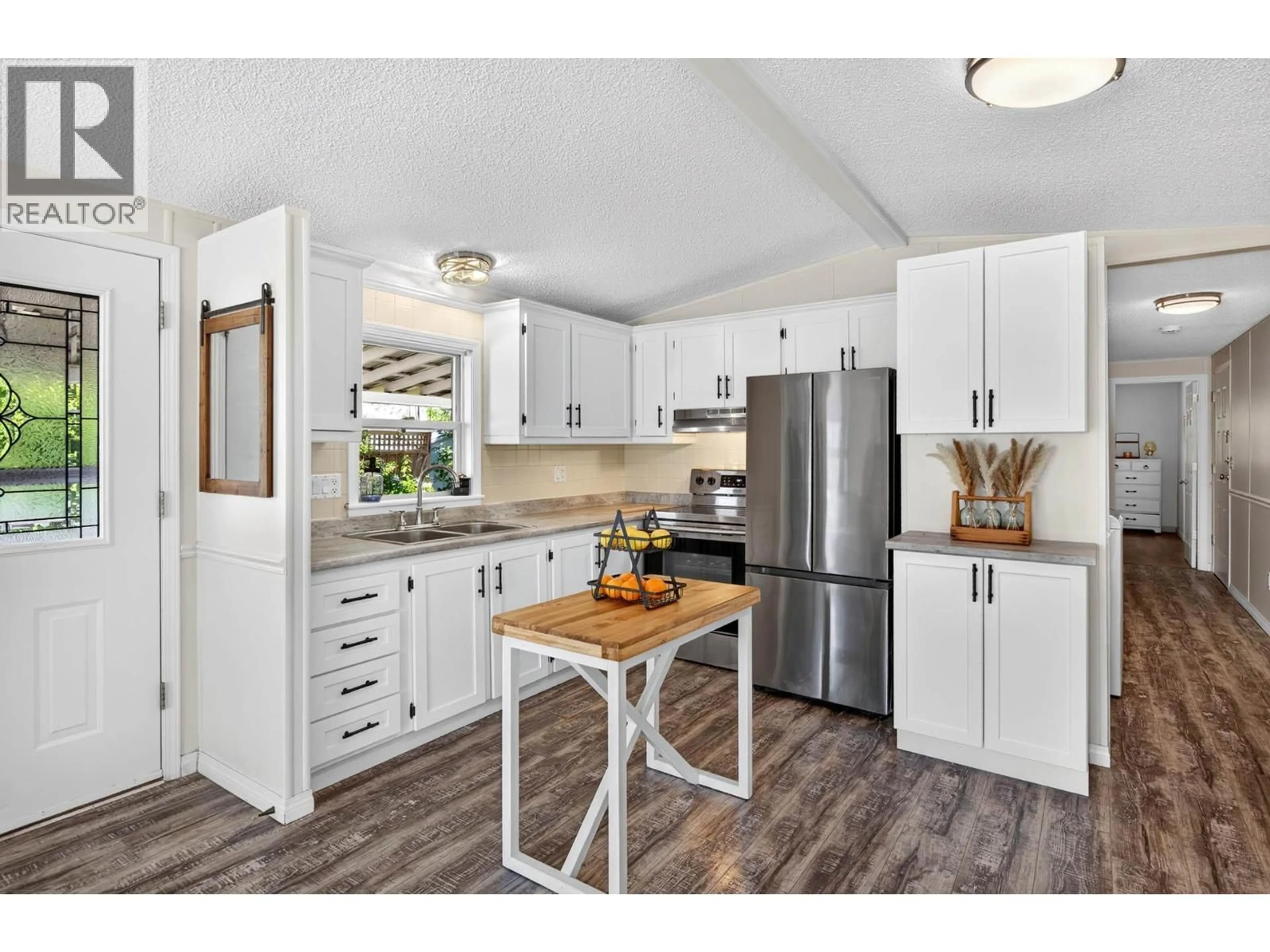 Open concept kitchen, wood/laminate floor for 14 - 2380 WESTSYDE ROAD, Kamloops British Columbia V2B7V4