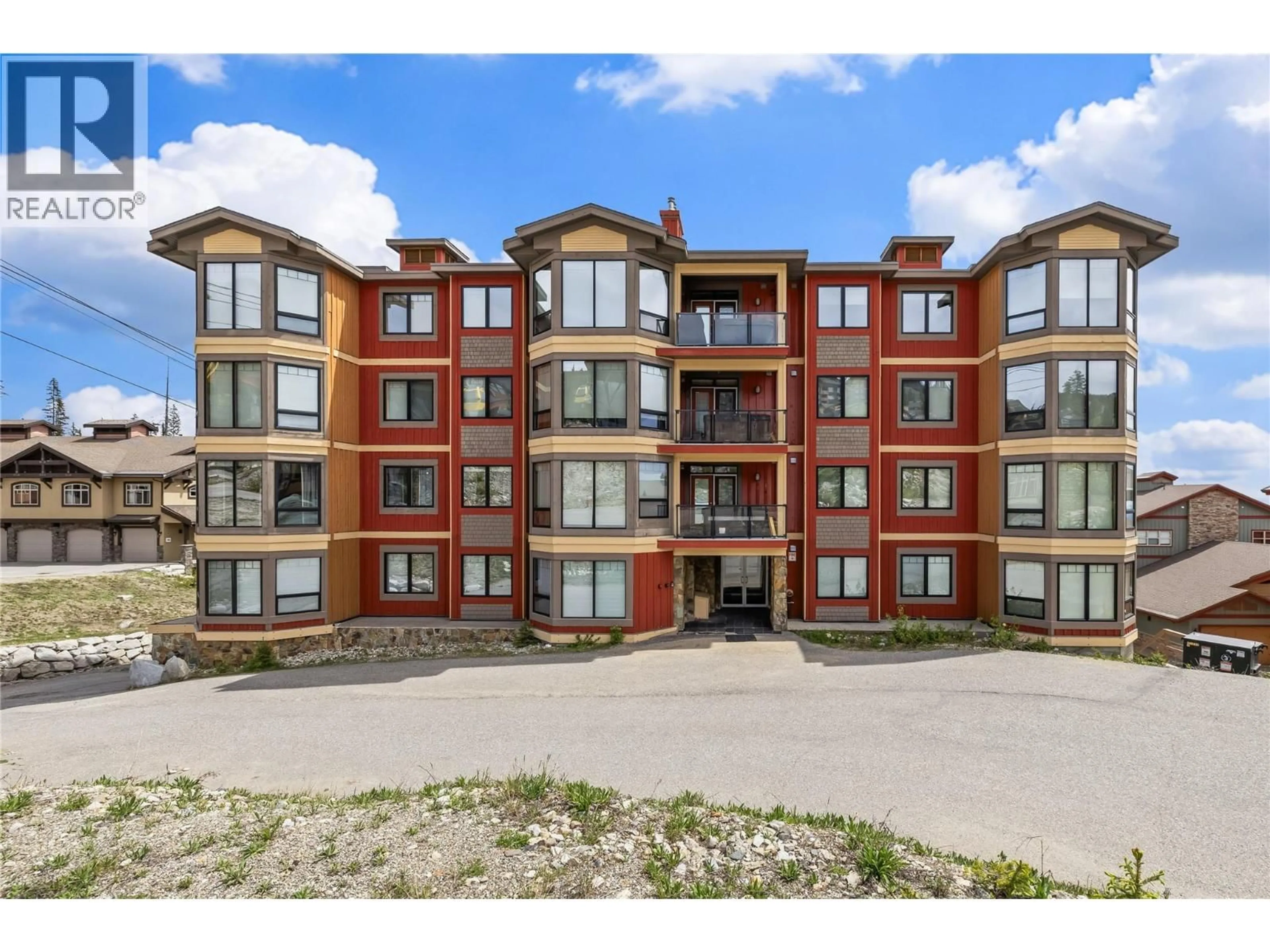 A pic from outside/outdoor area/front of a property/back of a property/a pic from drone, building for 103 - 5085 SNOWBIRD WAY, Big White British Columbia V1P1T4