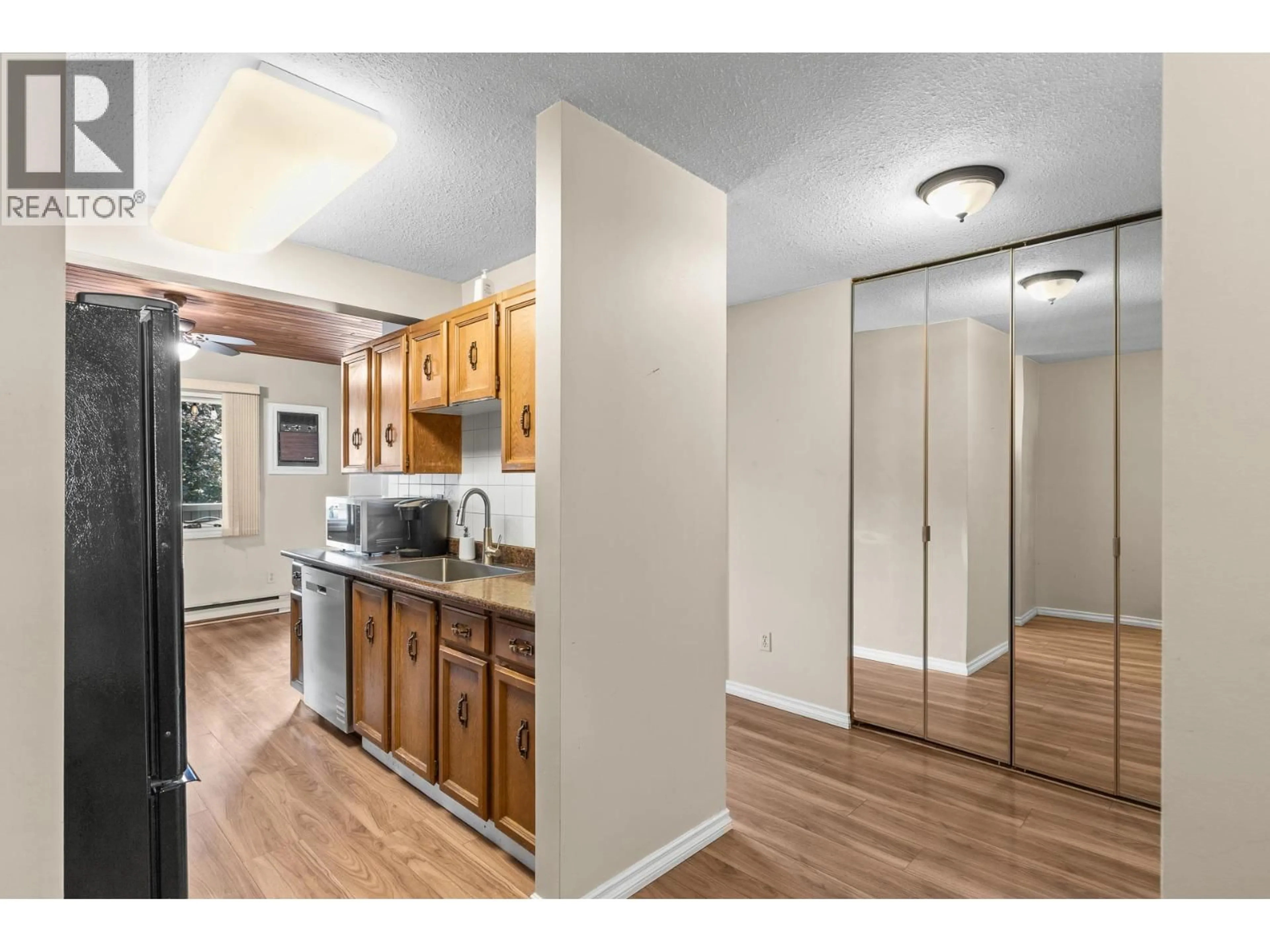 Standard kitchen, wood/laminate floor for 225 - 240 MCINTOSH ROAD, Kelowna British Columbia V1X2C4