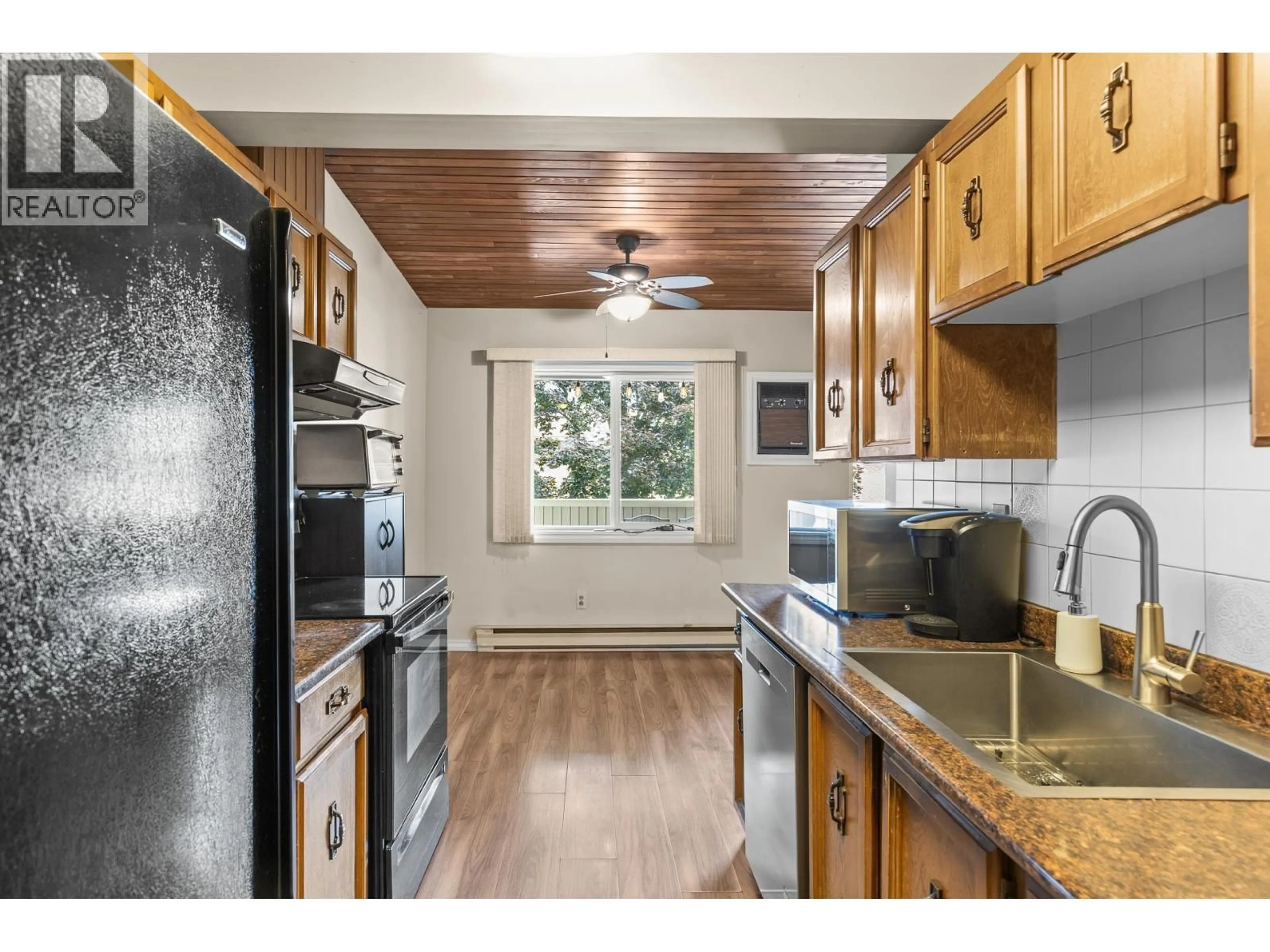 Standard kitchen, wood/laminate floor for 225 - 240 MCINTOSH ROAD, Kelowna British Columbia V1X2C4