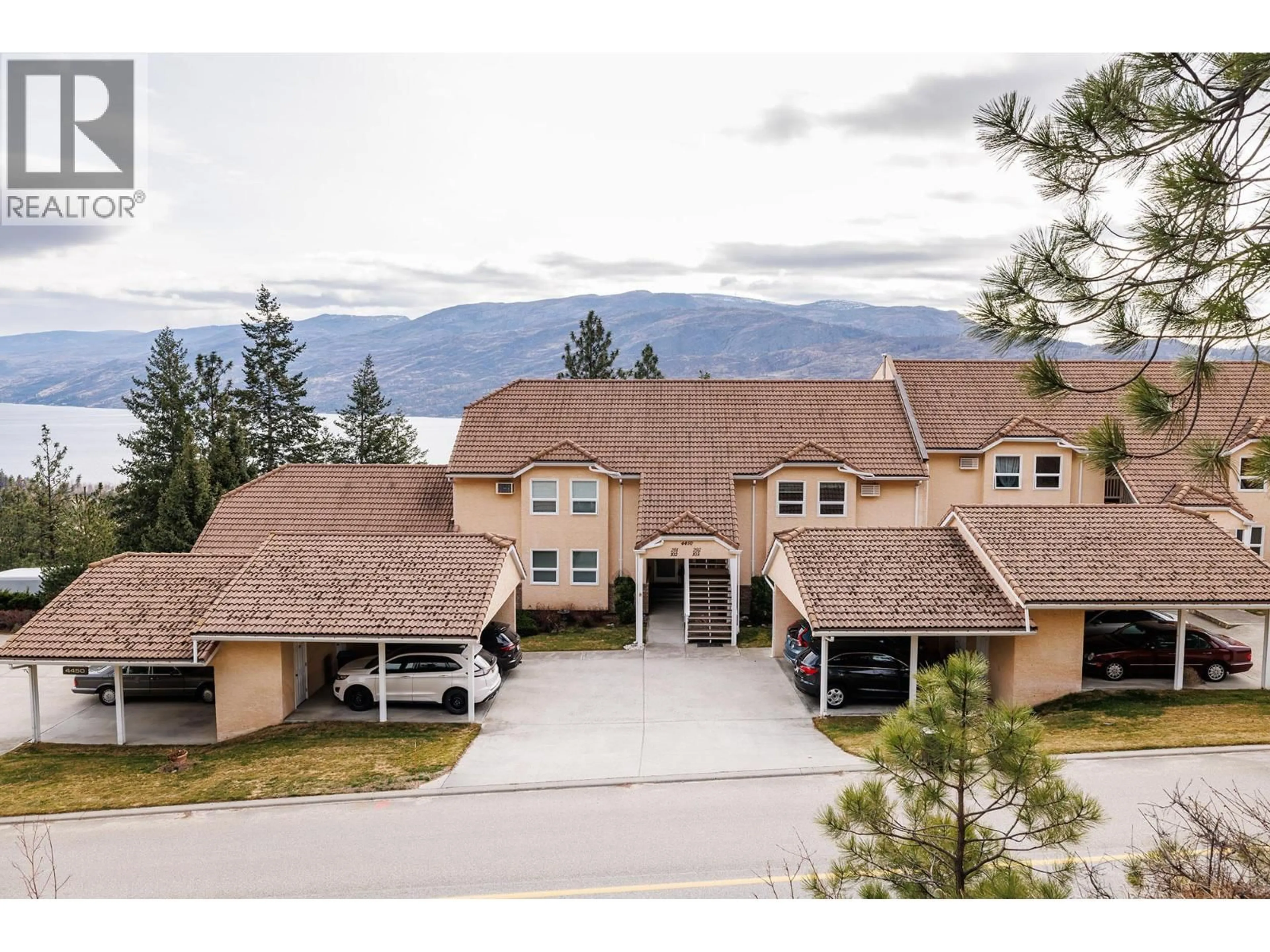 A pic from outside/outdoor area/front of a property/back of a property/a pic from drone, mountain view for 202 - 4450 PONDEROSA DRIVE, Peachland British Columbia V0H1X5