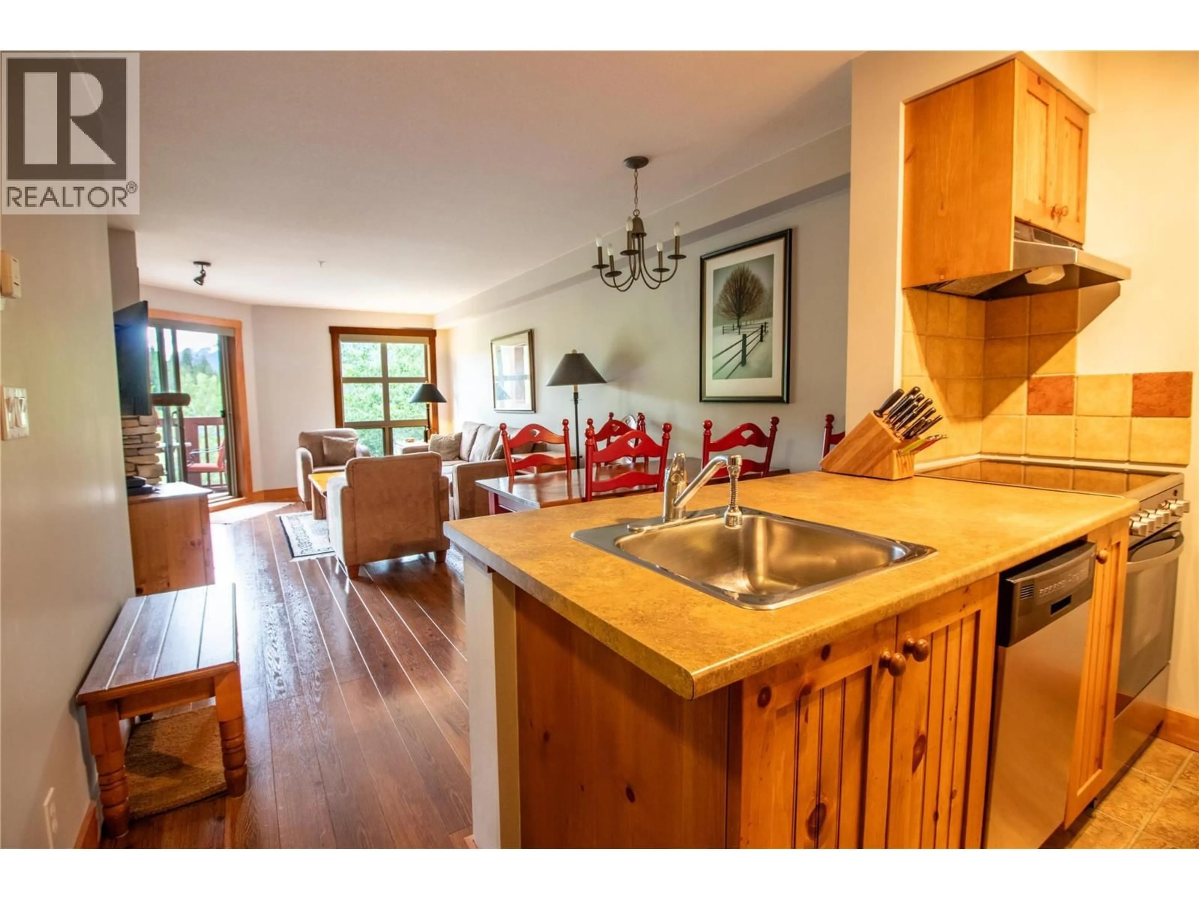 Open concept kitchen, wood/laminate floor for 309 - 2080 SUMMIT DRIVE, Panorama British Columbia V0A1T0