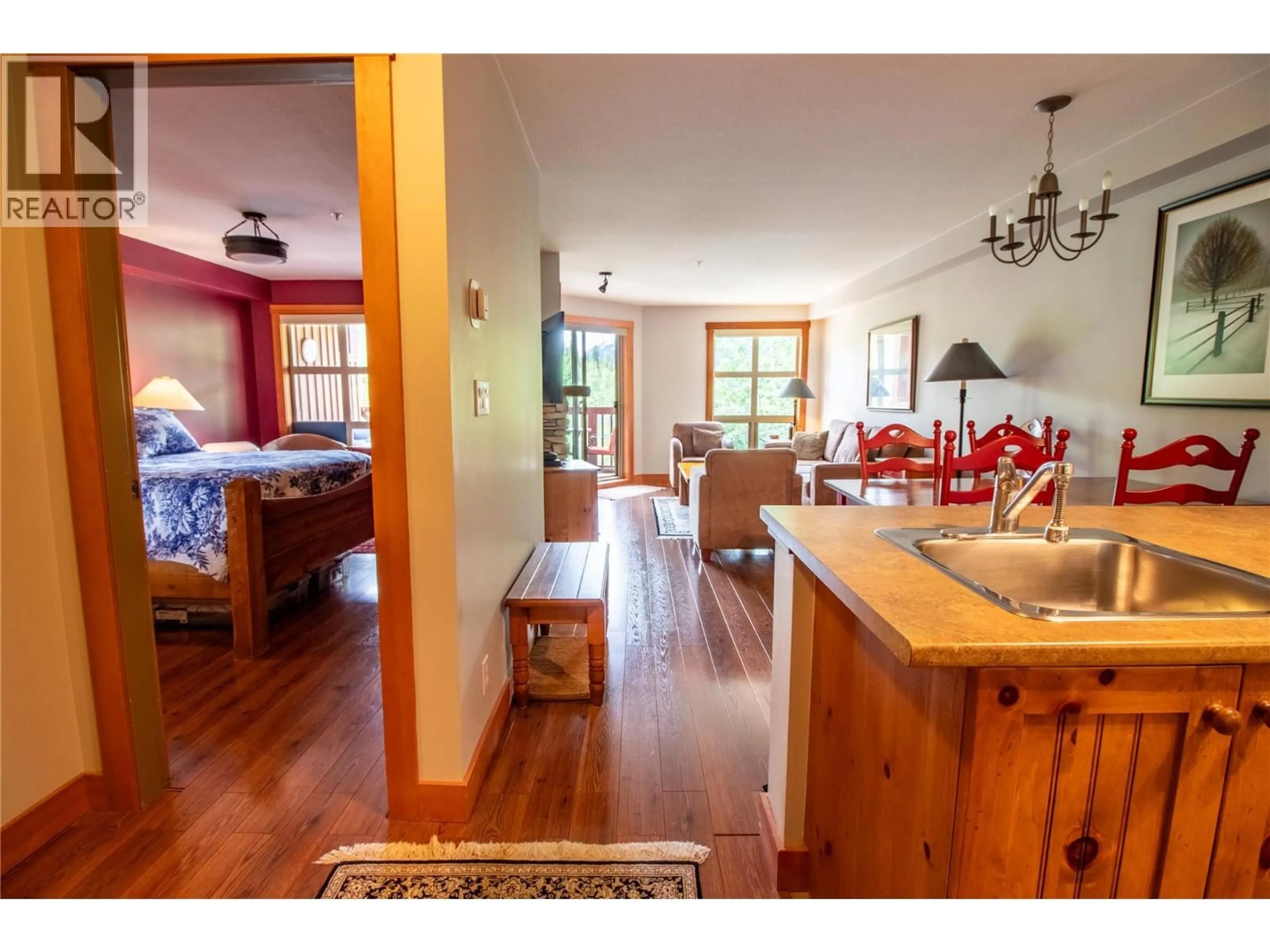 Open concept kitchen, wood/laminate floor for 309 - 2080 SUMMIT DRIVE, Panorama British Columbia V0A1T0