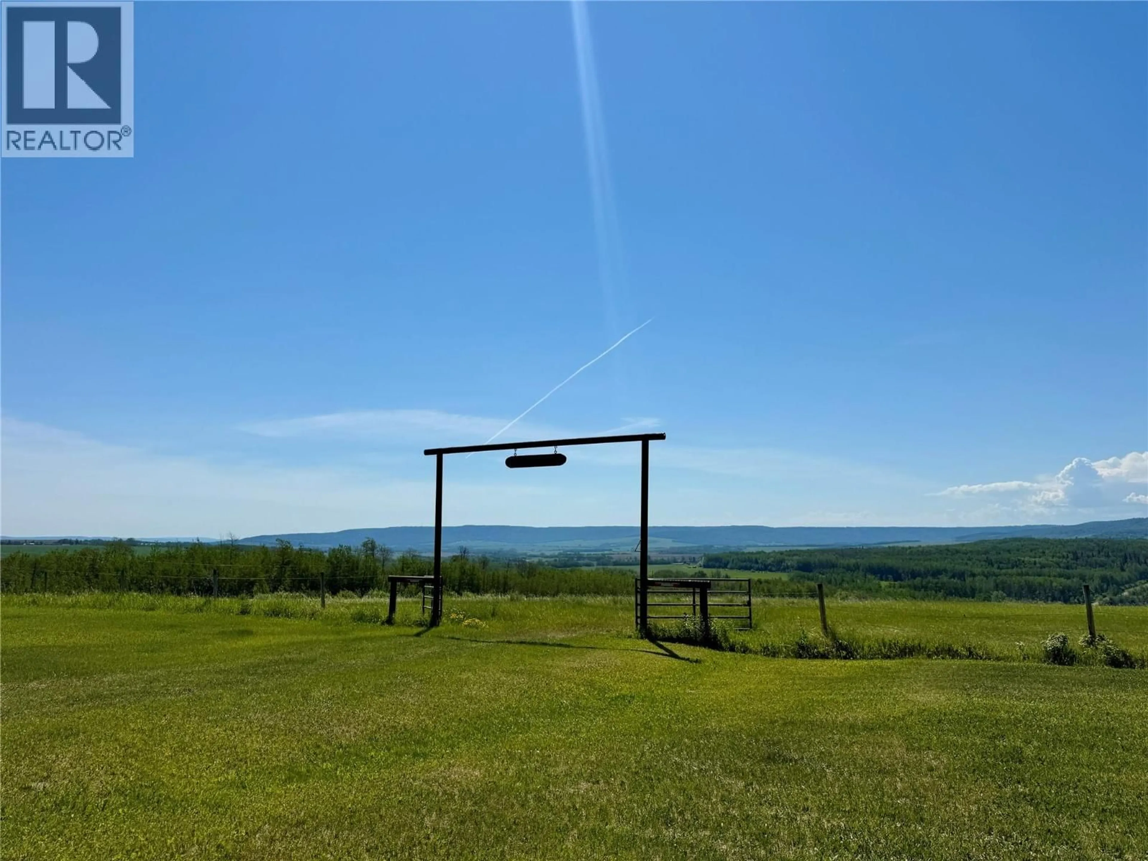A pic from outside/outdoor area/front of a property/back of a property/a pic from drone, mountain view for 9843 231 ROAD, Dawson Creek British Columbia V0C1B0
