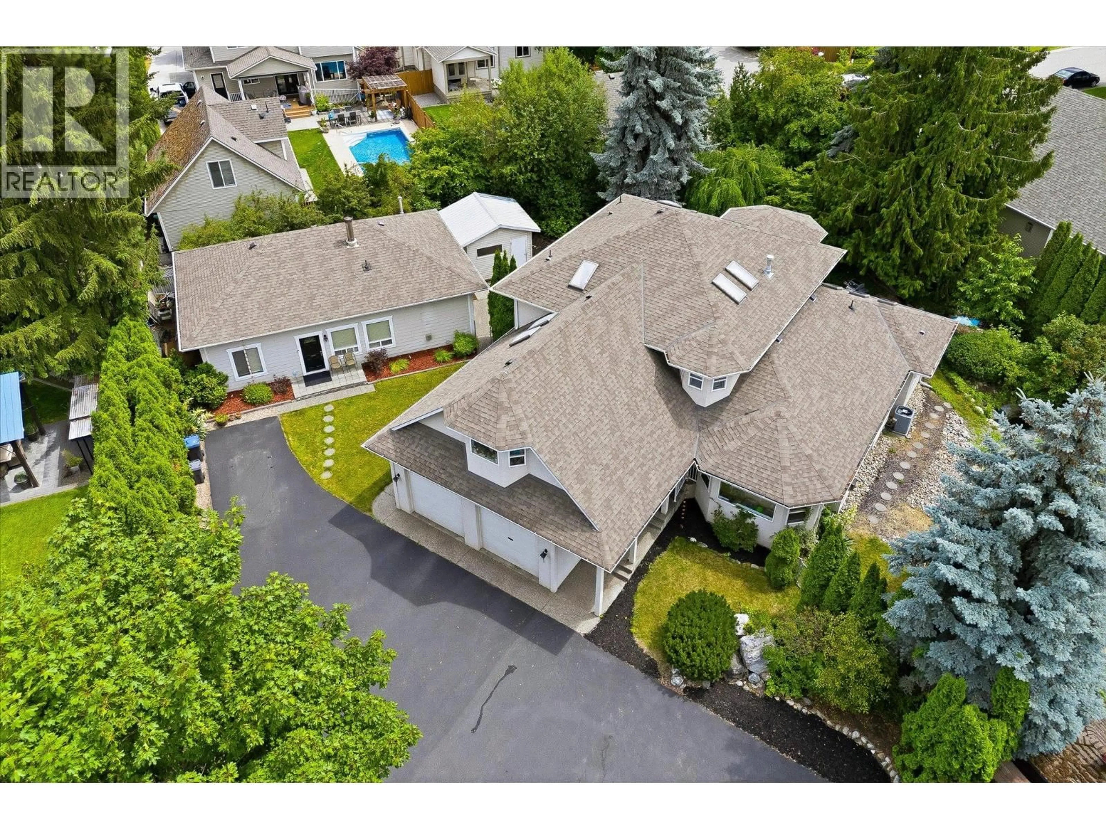 A pic from outside/outdoor area/front of a property/back of a property/a pic from drone, street for 4619 GORDON DRIVE, Kelowna British Columbia V1W1T5