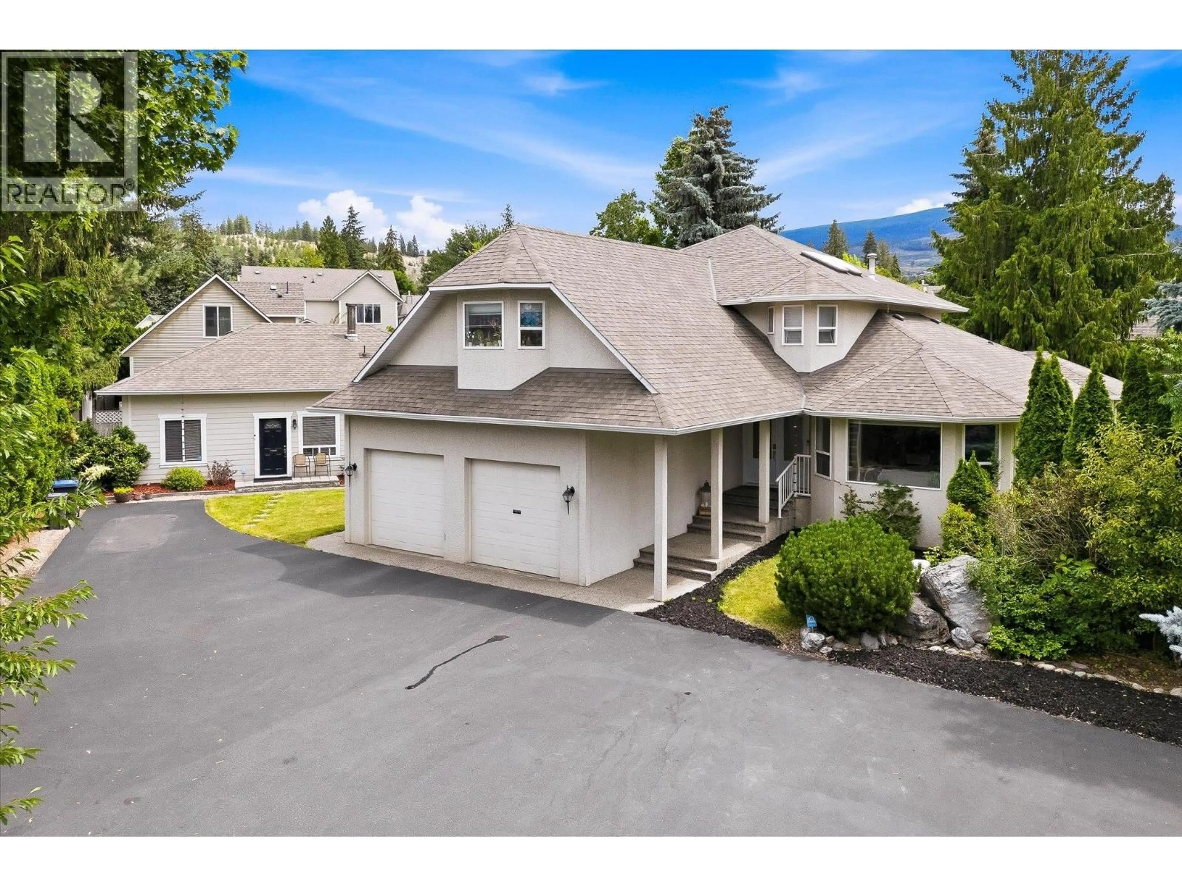 A pic from outside/outdoor area/front of a property/back of a property/a pic from drone, mountain view for 4619 GORDON DRIVE, Kelowna British Columbia V1W1T5