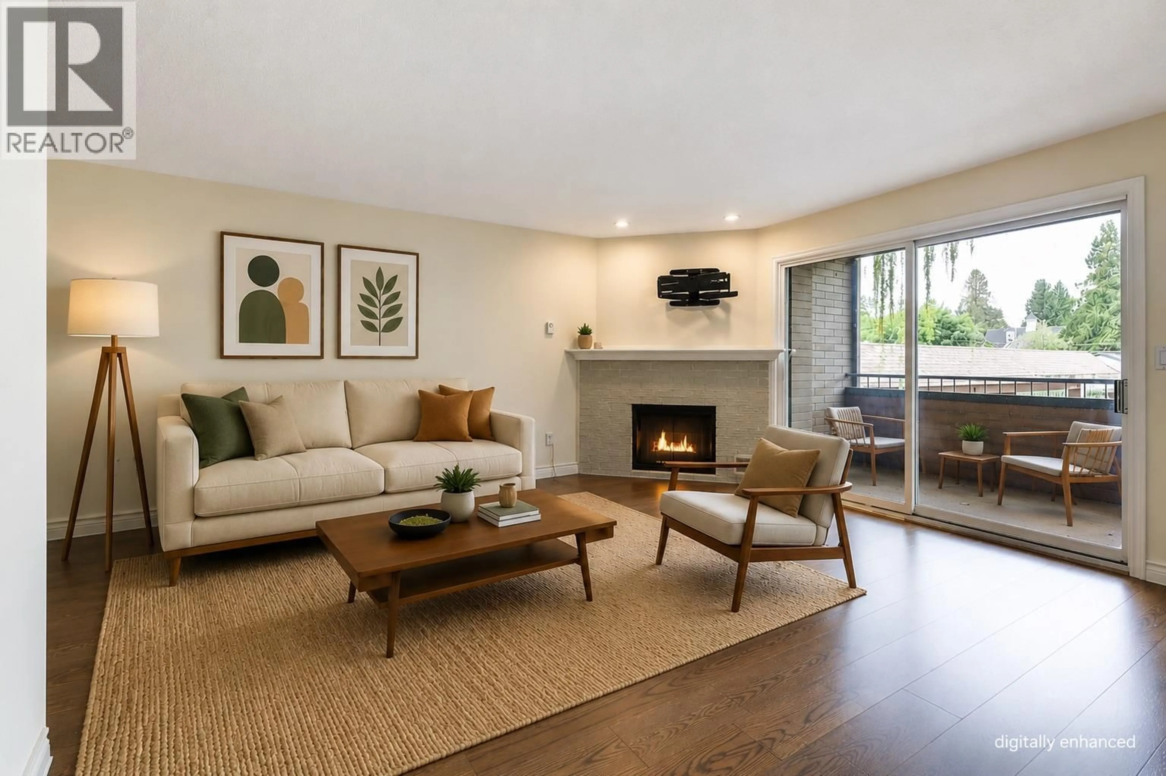 Living room with furniture, wood/laminate floor for 206 - 983 BERNARD AVENUE, Kelowna British Columbia V1Y6P7