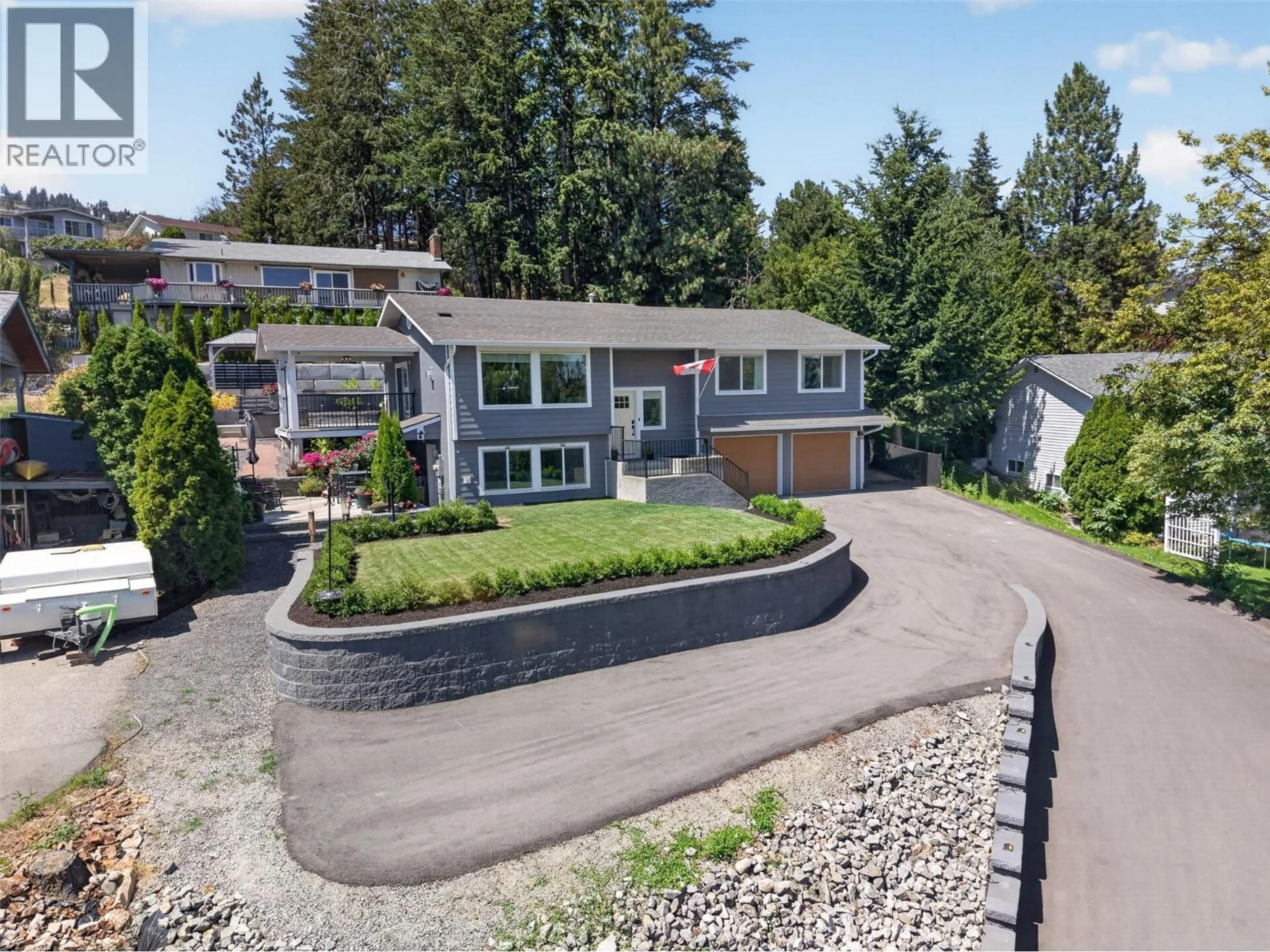 A pic from outside/outdoor area/front of a property/back of a property/a pic from drone, street for 3752 GLENWAY ROAD, West Kelowna British Columbia V4T1E3
