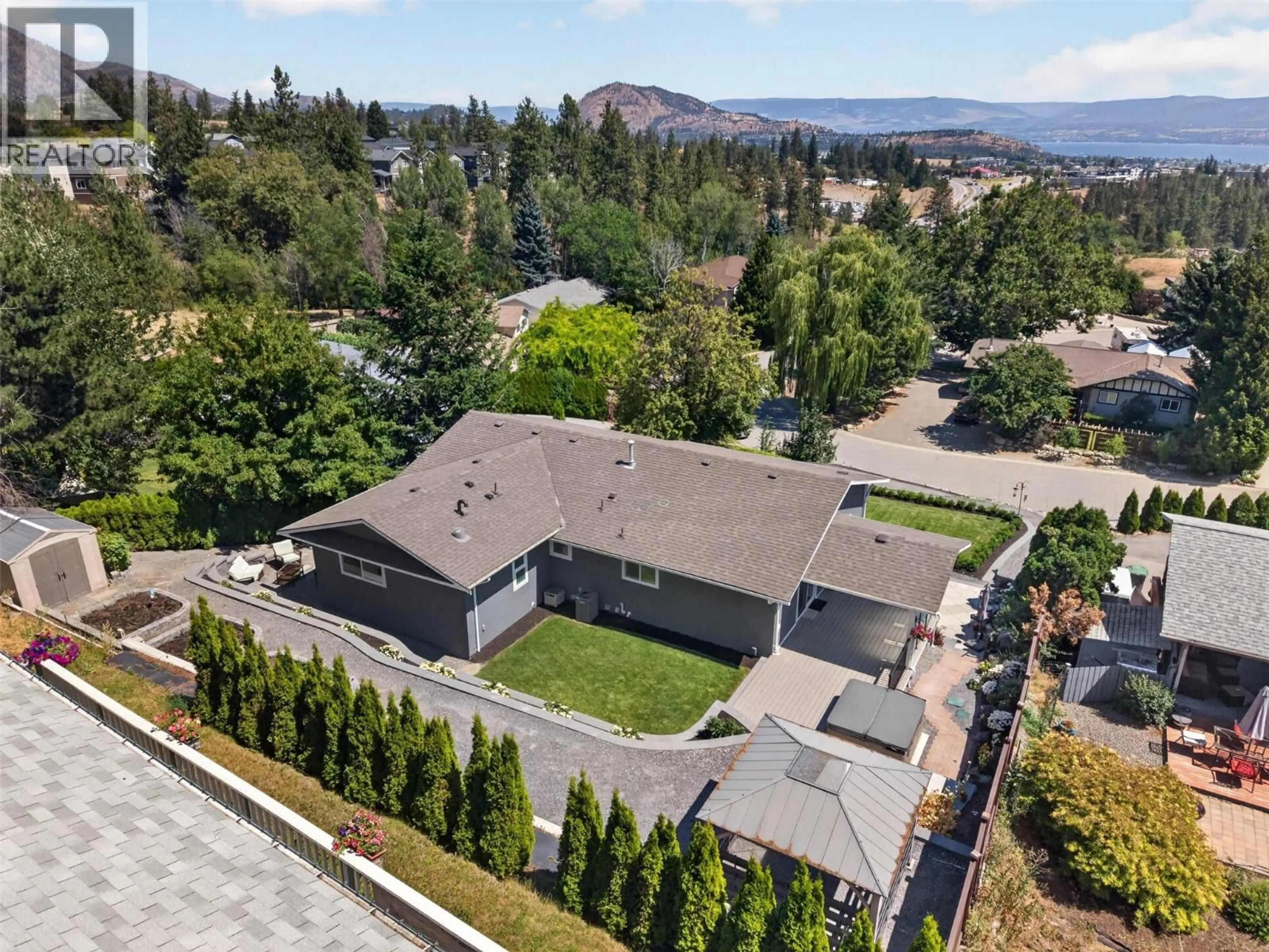 A pic from outside/outdoor area/front of a property/back of a property/a pic from drone, mountain view for 3752 GLENWAY ROAD, West Kelowna British Columbia V4T1E3