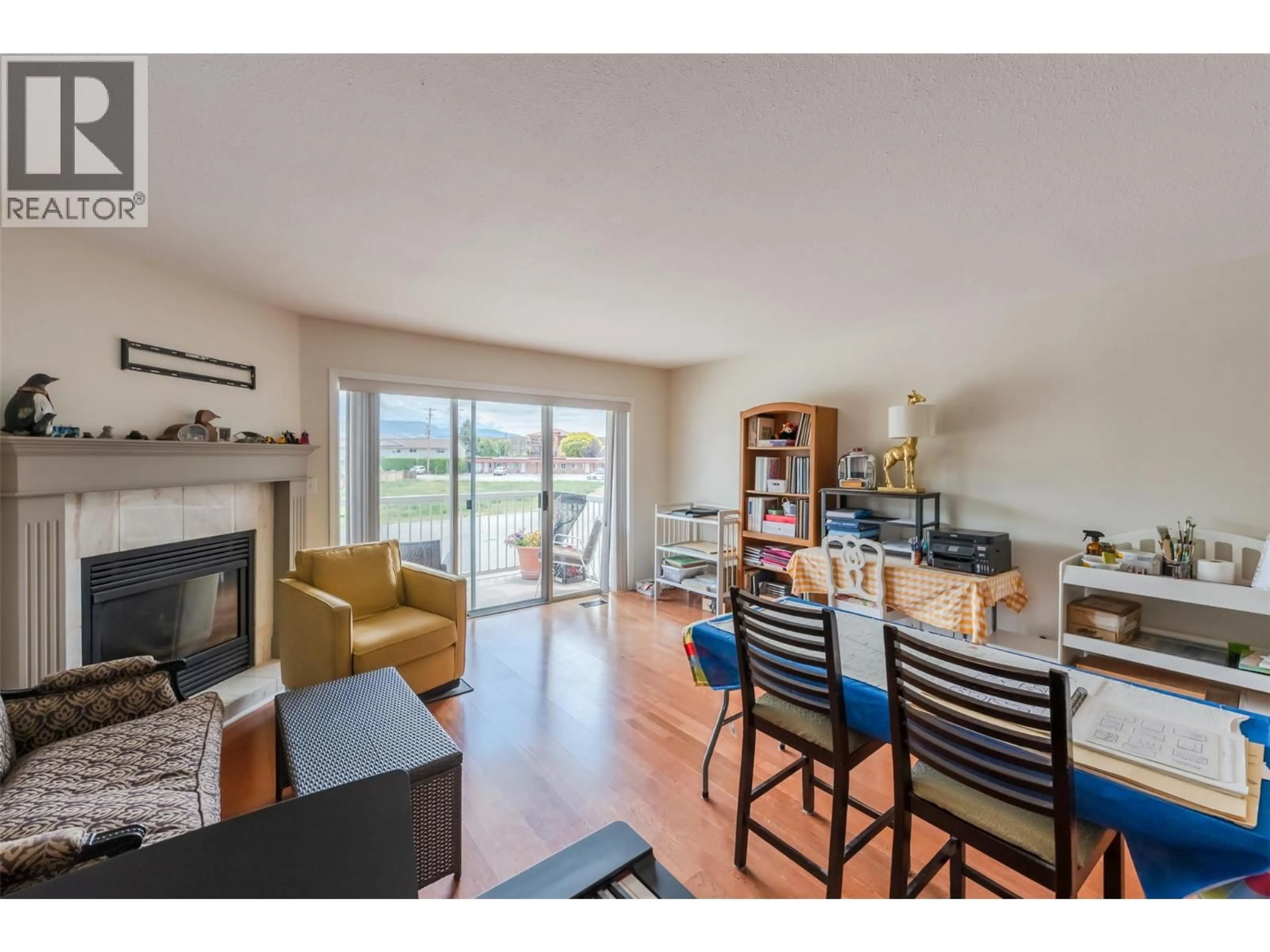 Living room with furniture, wood/laminate floor for 5 - 6801 COTTONWOOD DRIVE, Osoyoos British Columbia V0H1V3