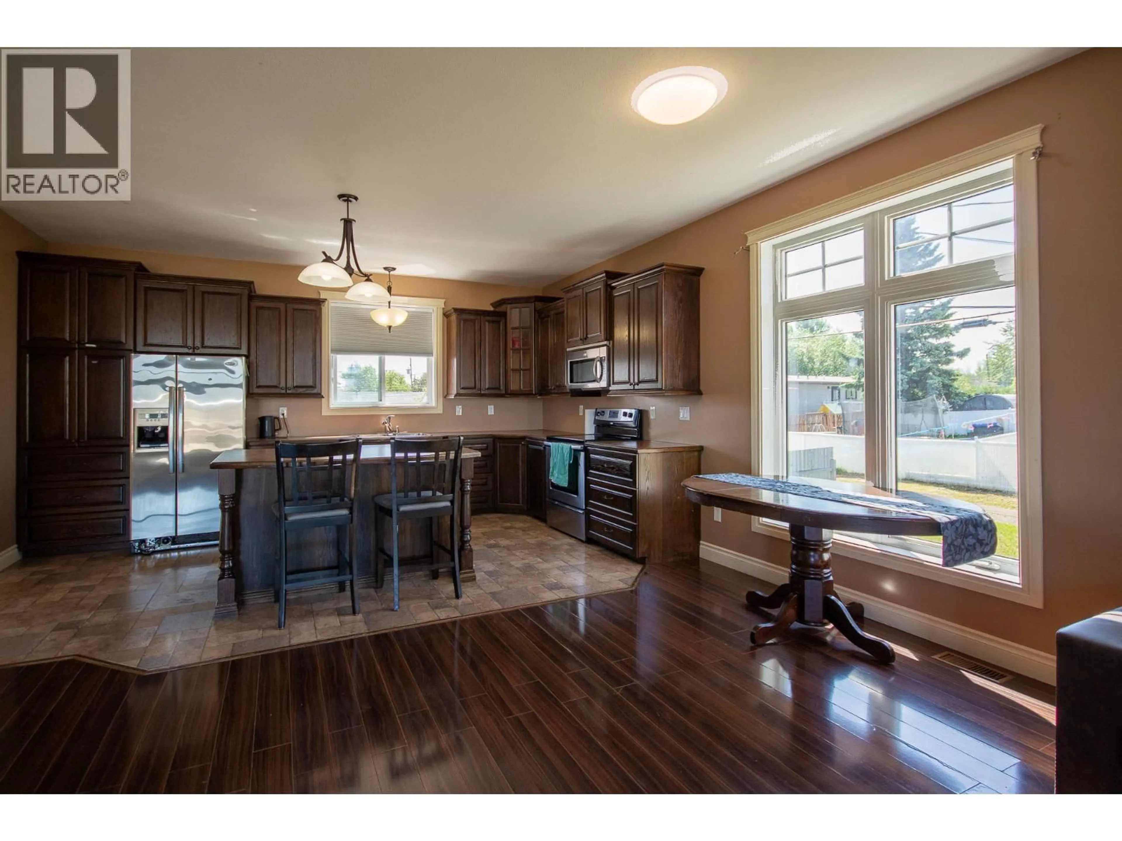 Open concept kitchen, wood/laminate floor for 12000 11 STREET, Dawson Creek British Columbia V1G3J8