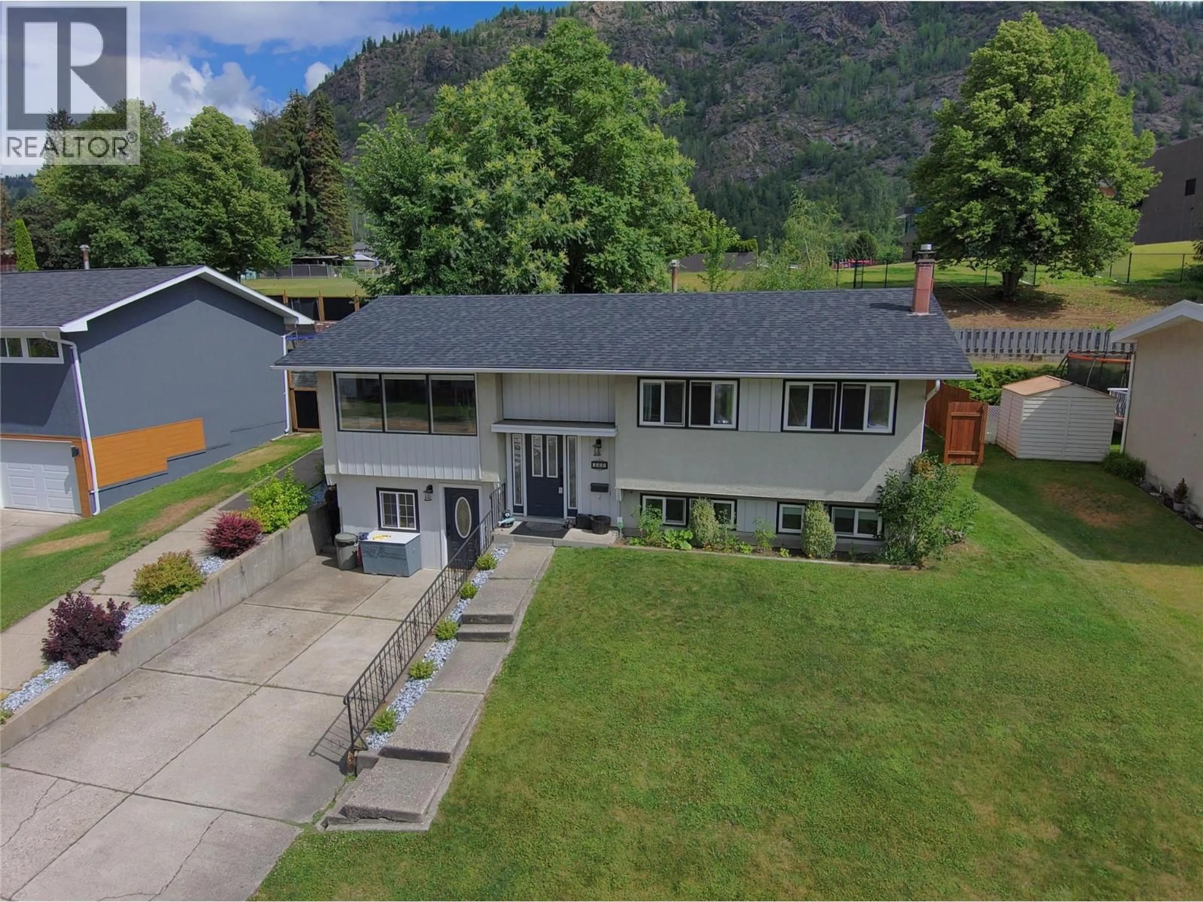 A pic from outside/outdoor area/front of a property/back of a property/a pic from drone, mountain view for 3551 HIGHWAY DRIVE, Trail British Columbia V1R2T9