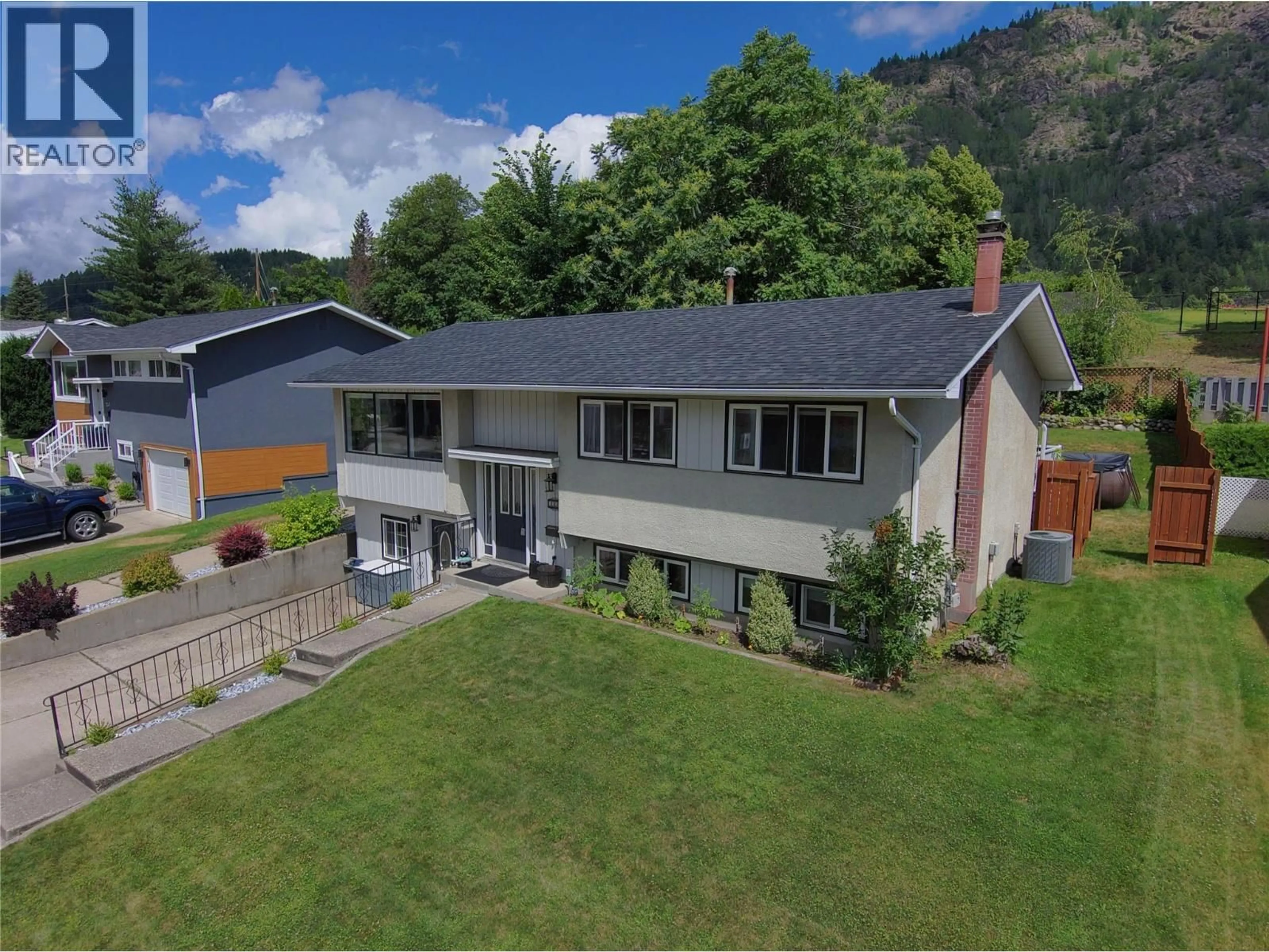 A pic from outside/outdoor area/front of a property/back of a property/a pic from drone, mountain view for 3551 HIGHWAY DRIVE, Trail British Columbia V1R2T9