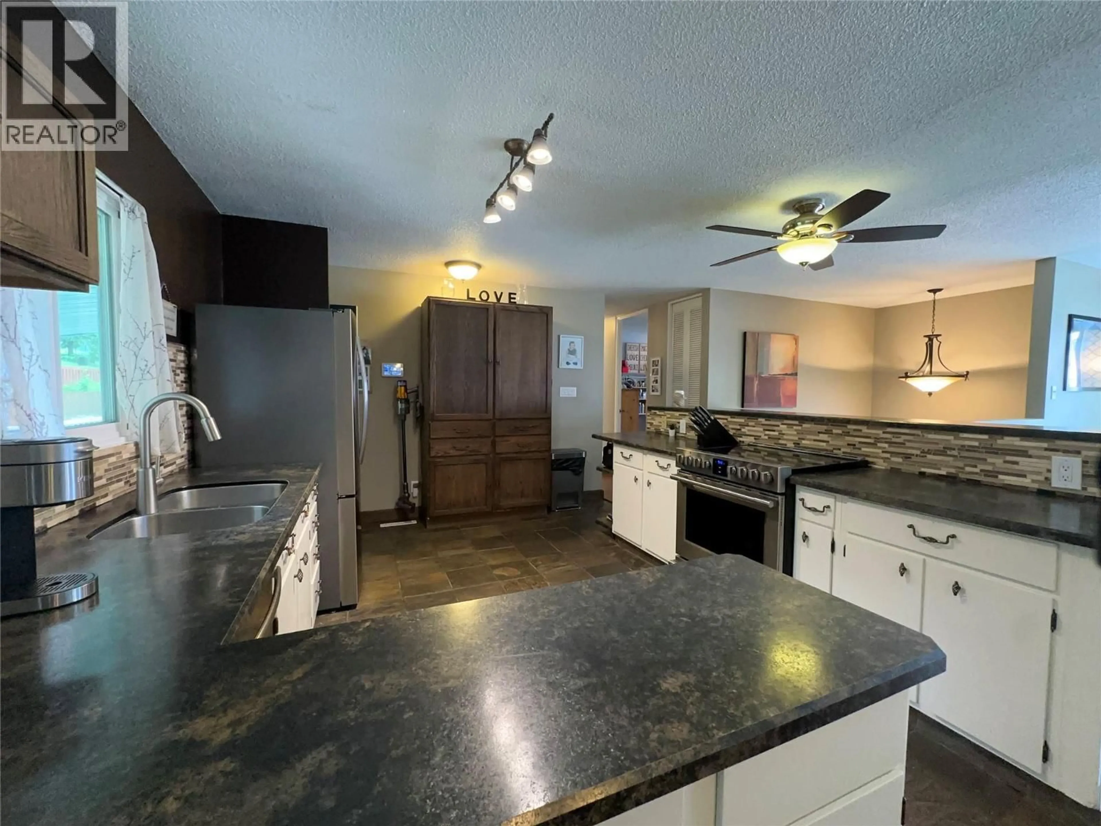 Open concept kitchen, ceramic/tile floor for 3551 HIGHWAY DRIVE, Trail British Columbia V1R2T9