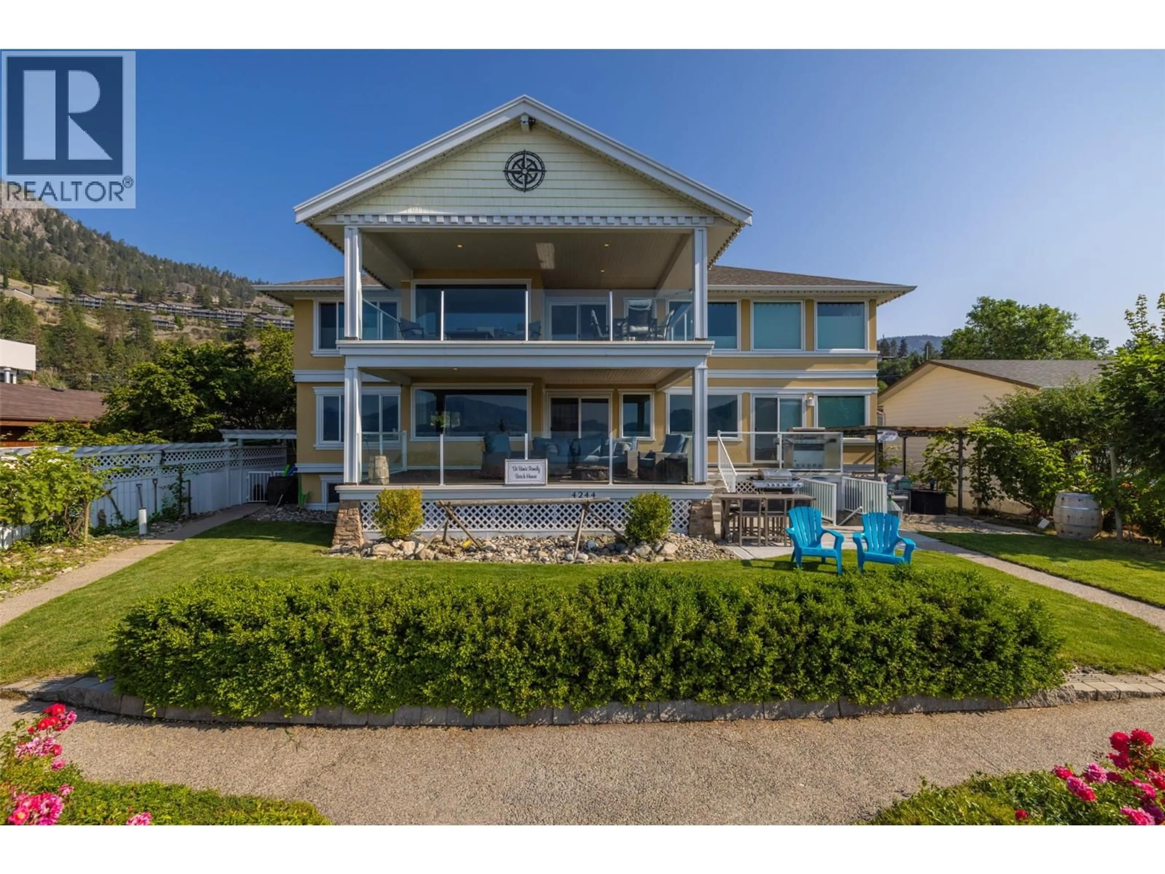 A pic from outside/outdoor area/front of a property/back of a property/a pic from drone, water/lake/river/ocean view for 4244 BEACH AVENUE, Peachland British Columbia V0H1X6