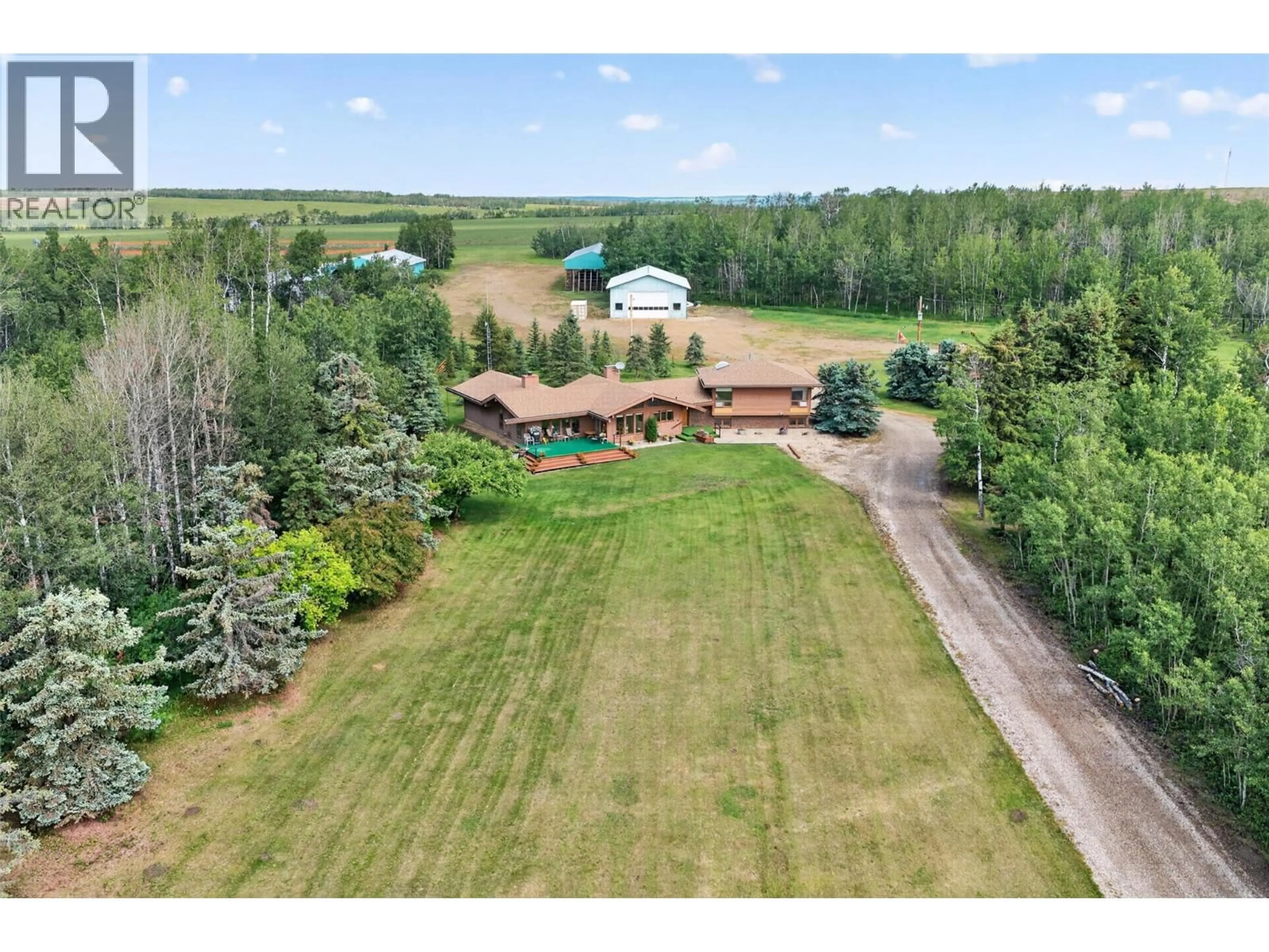 A pic from outside/outdoor area/front of a property/back of a property/a pic from drone, unknown for 3422 208 ROAD, Dawson Creek British Columbia V1G4H3