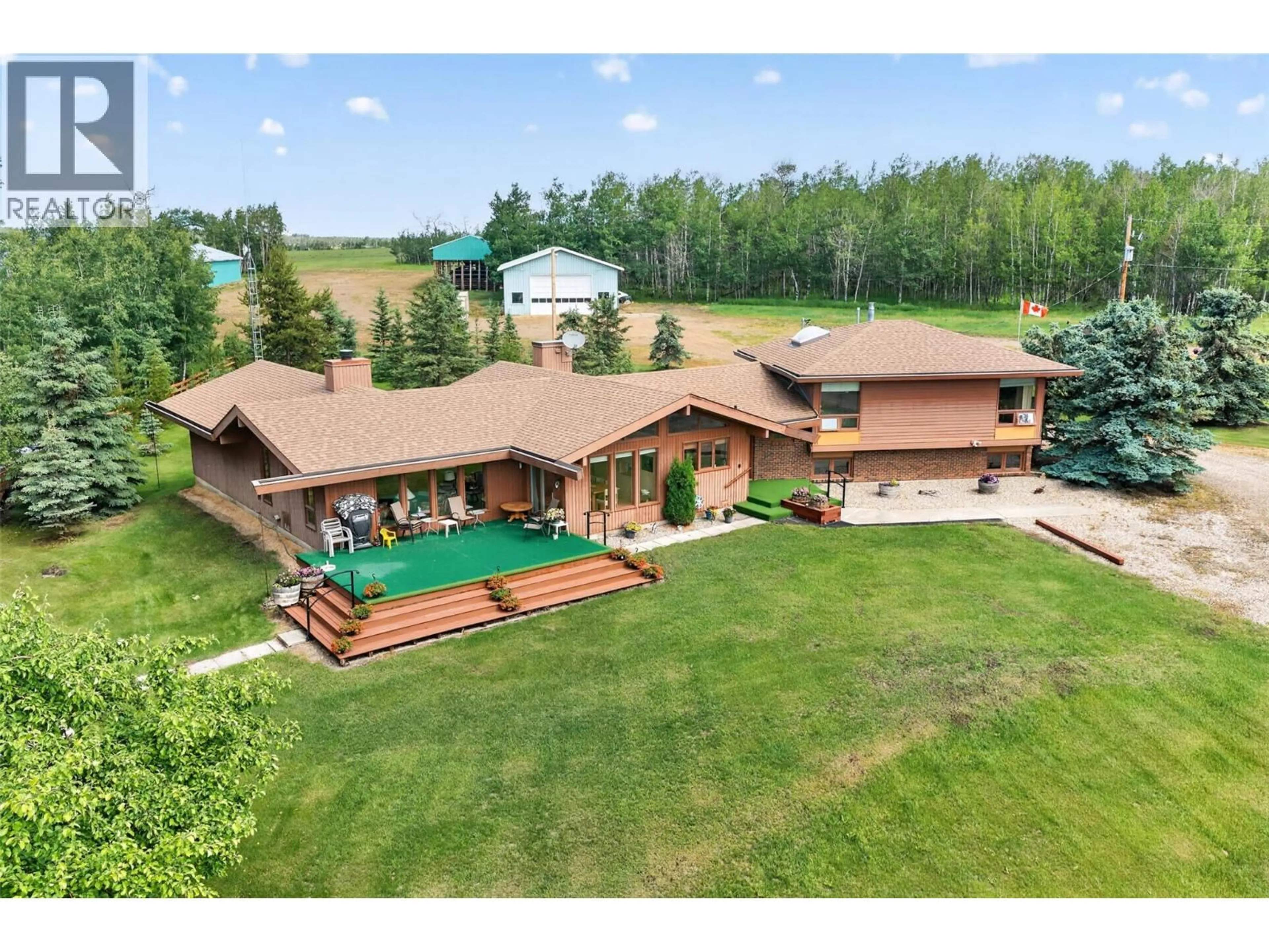 A pic from outside/outdoor area/front of a property/back of a property/a pic from drone, mountain view for 3422 208 ROAD, Dawson Creek British Columbia V1G4H3