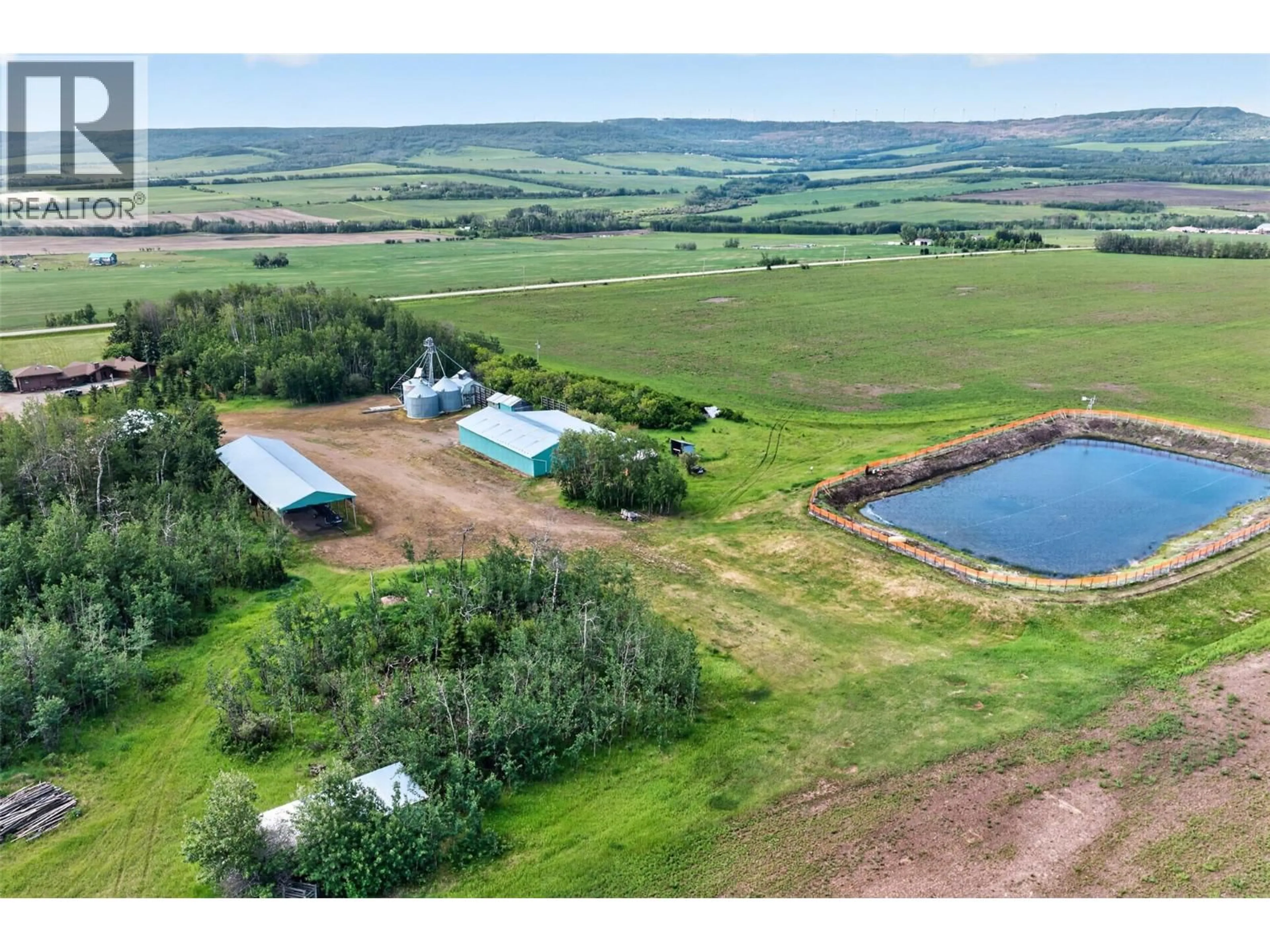 A pic from outside/outdoor area/front of a property/back of a property/a pic from drone, water/lake/river/ocean view for 3422 208 ROAD, Dawson Creek British Columbia V1G4H3