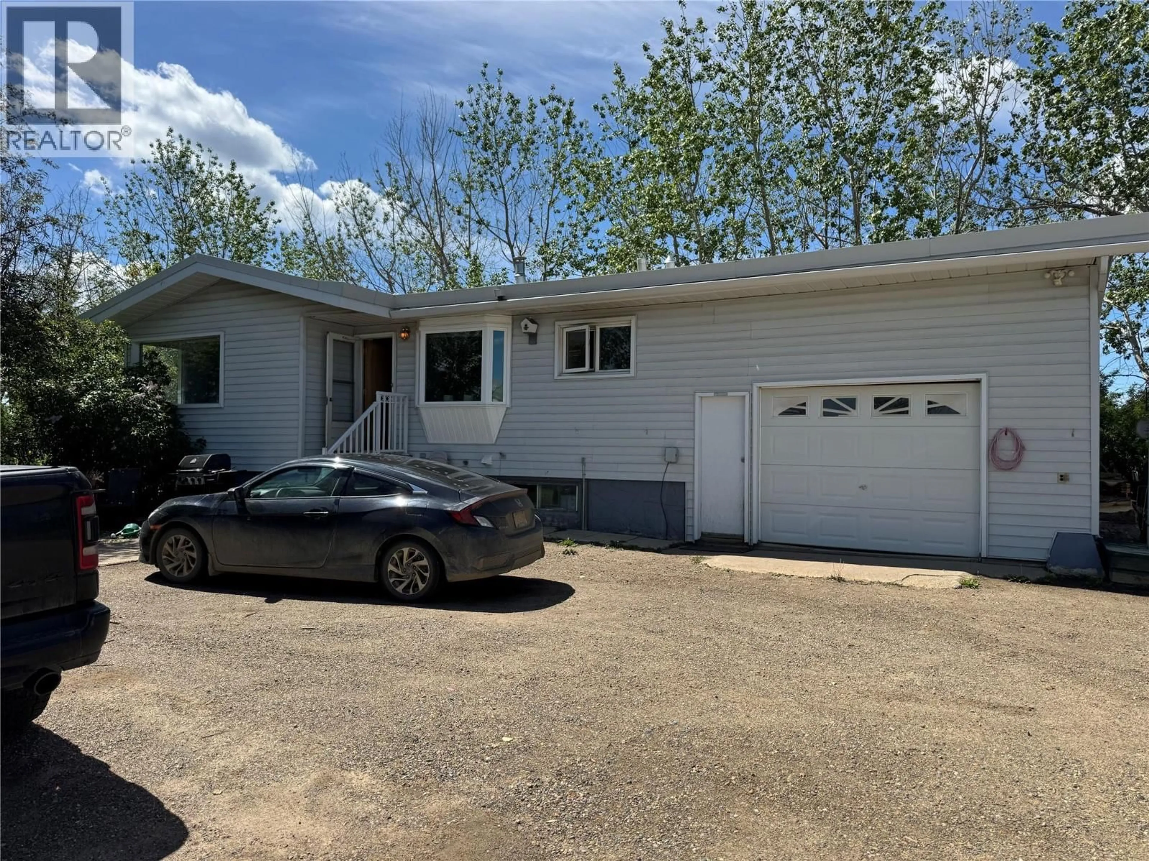 Home with vinyl exterior material, street for 3074 208 ROAD, Dawson Creek British Columbia V1G0C3