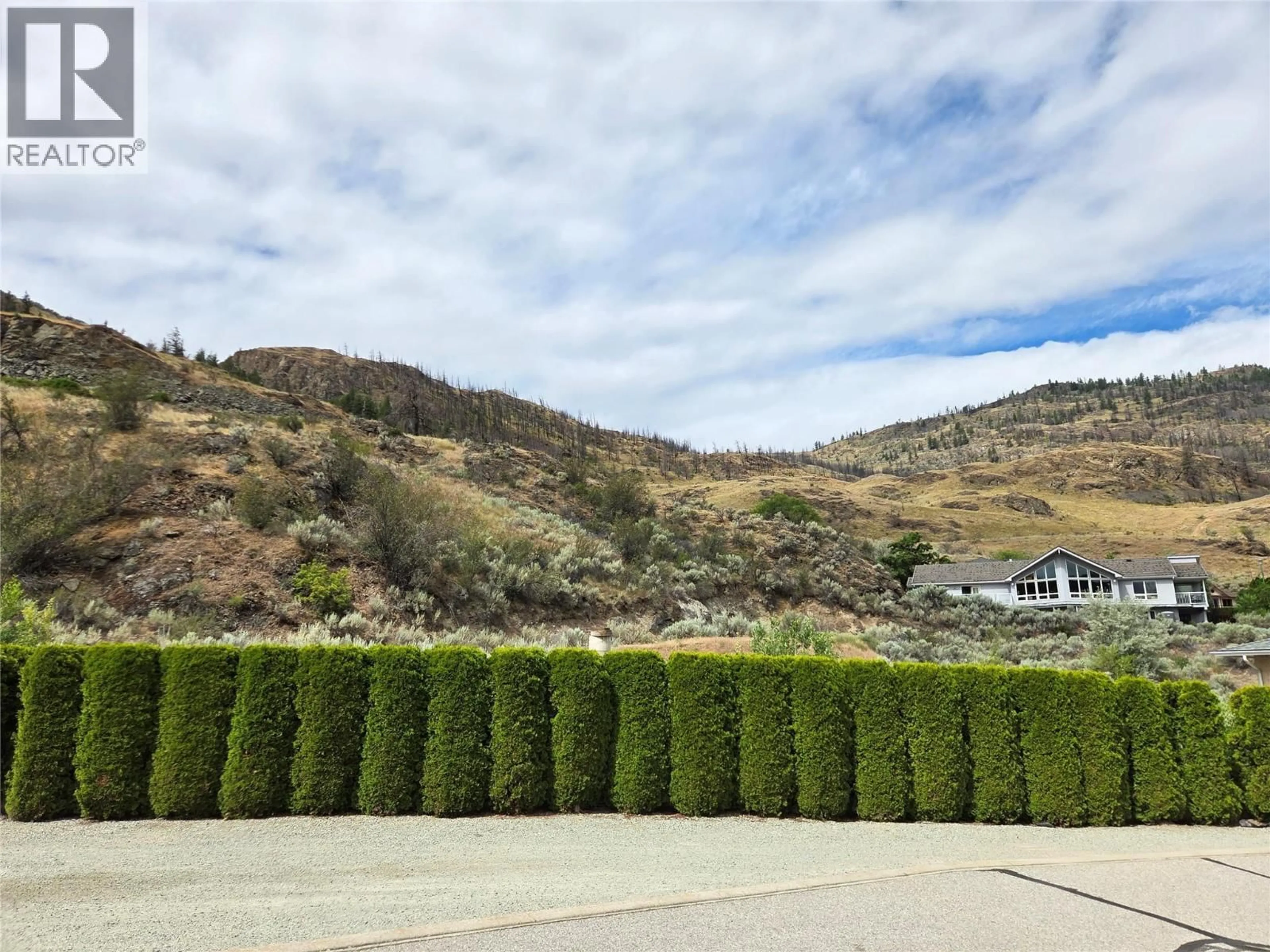 A pic from outside/outdoor area/front of a property/back of a property/a pic from drone, mountain view for 2 - 12300 PINEHURST PLACE, Osoyoos British Columbia V0H1V4