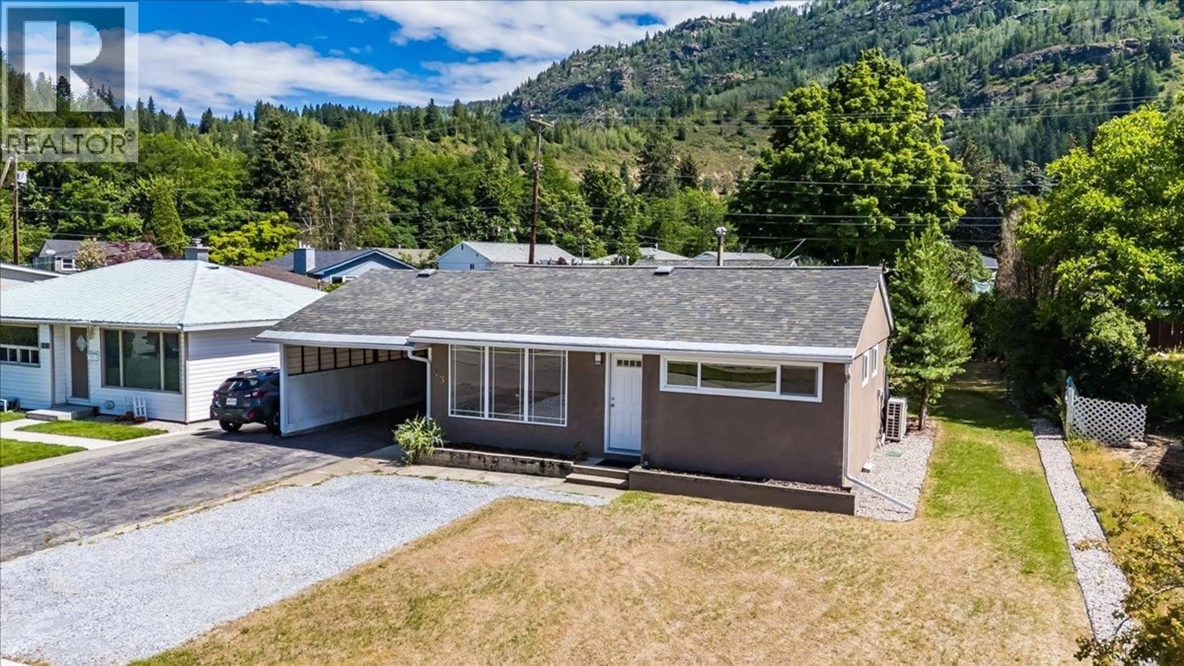 A pic from outside/outdoor area/front of a property/back of a property/a pic from drone, mountain view for 53 HAZLEWOOD DRIVE, Trail British Columbia V1R1G1