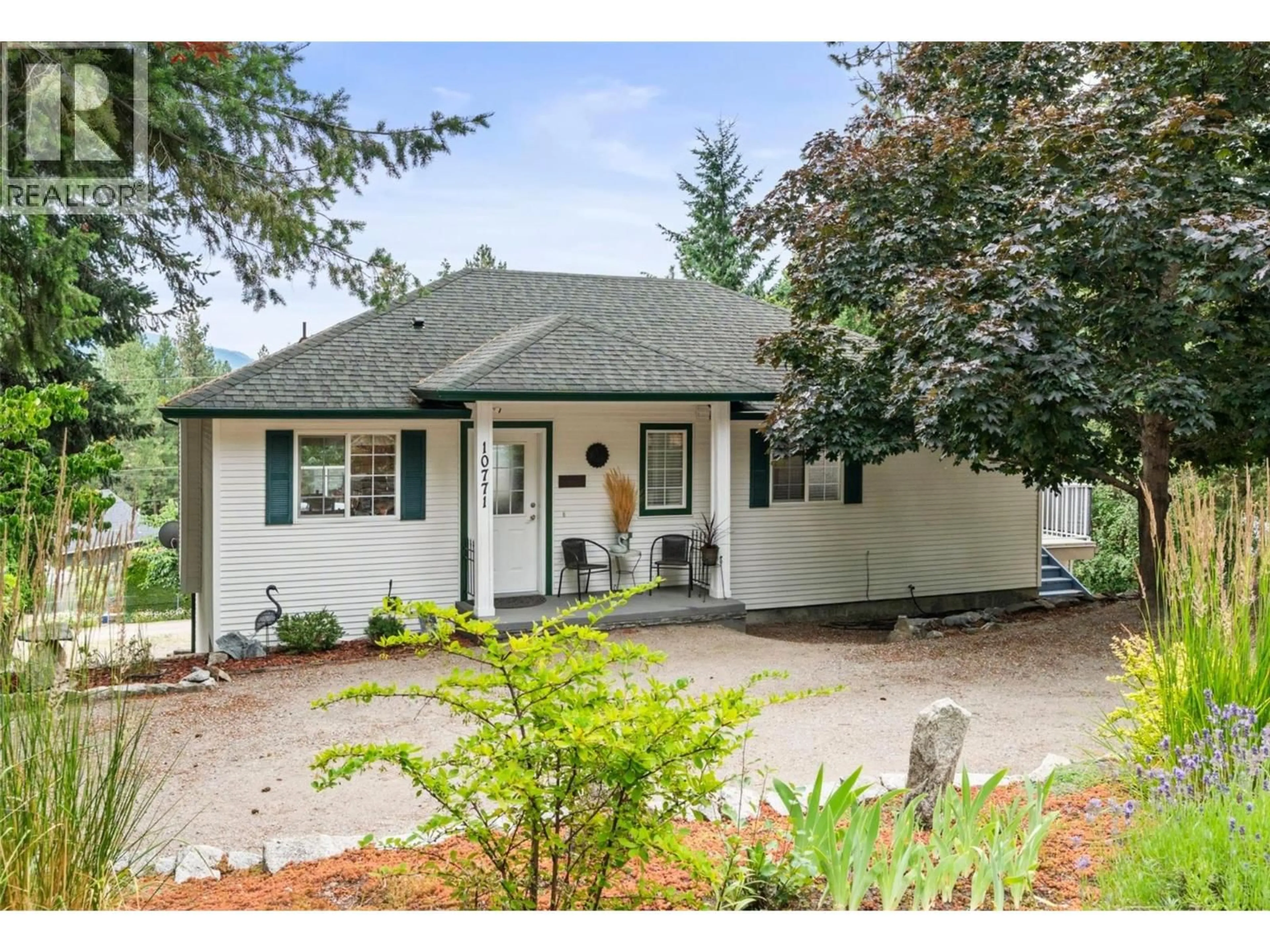 Home with vinyl exterior material, street for 10771 PINECREST ROAD, Vernon British Columbia V1H2C1