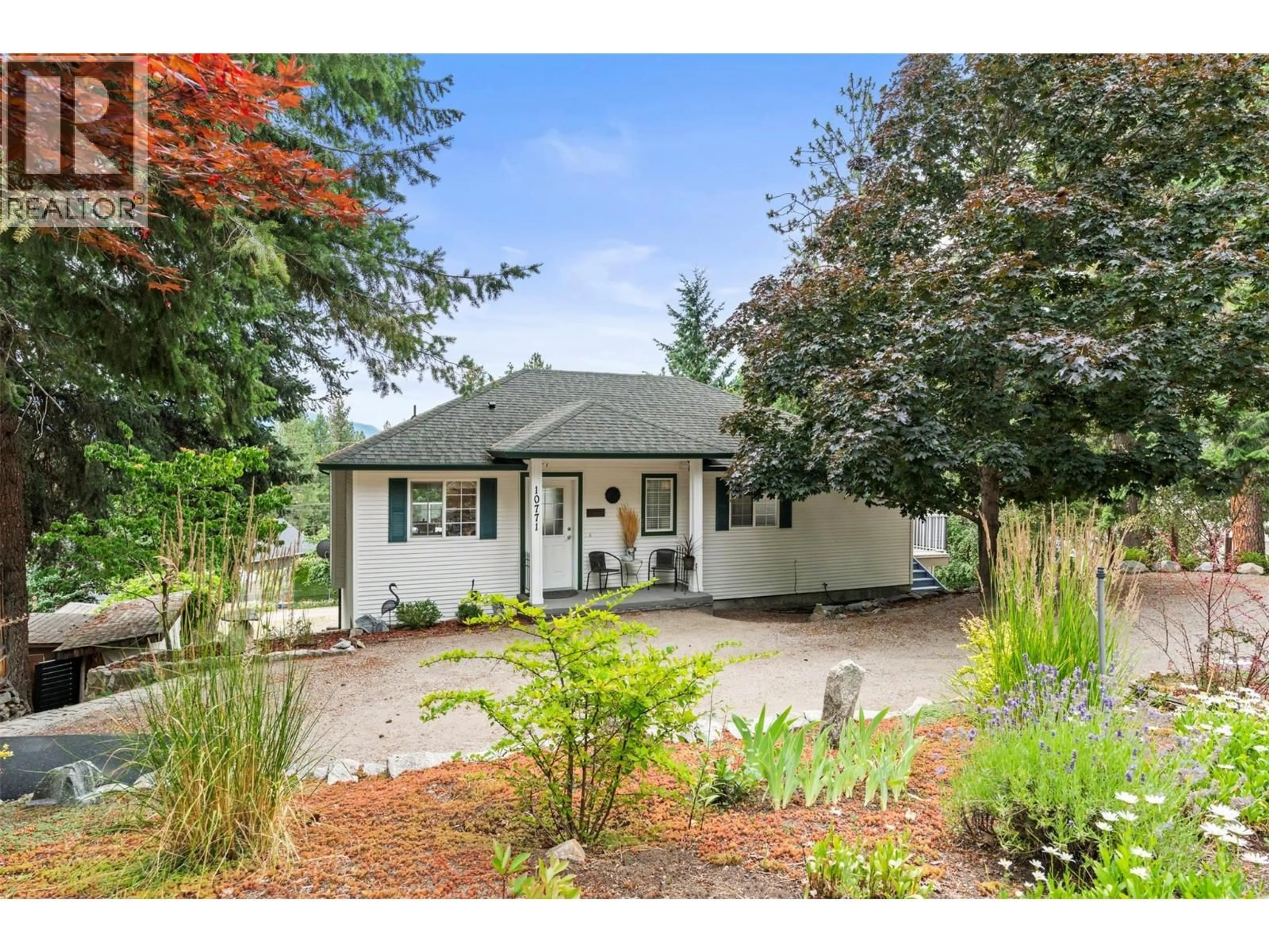 Home with vinyl exterior material, street for 10771 PINECREST ROAD, Vernon British Columbia V1H2C1
