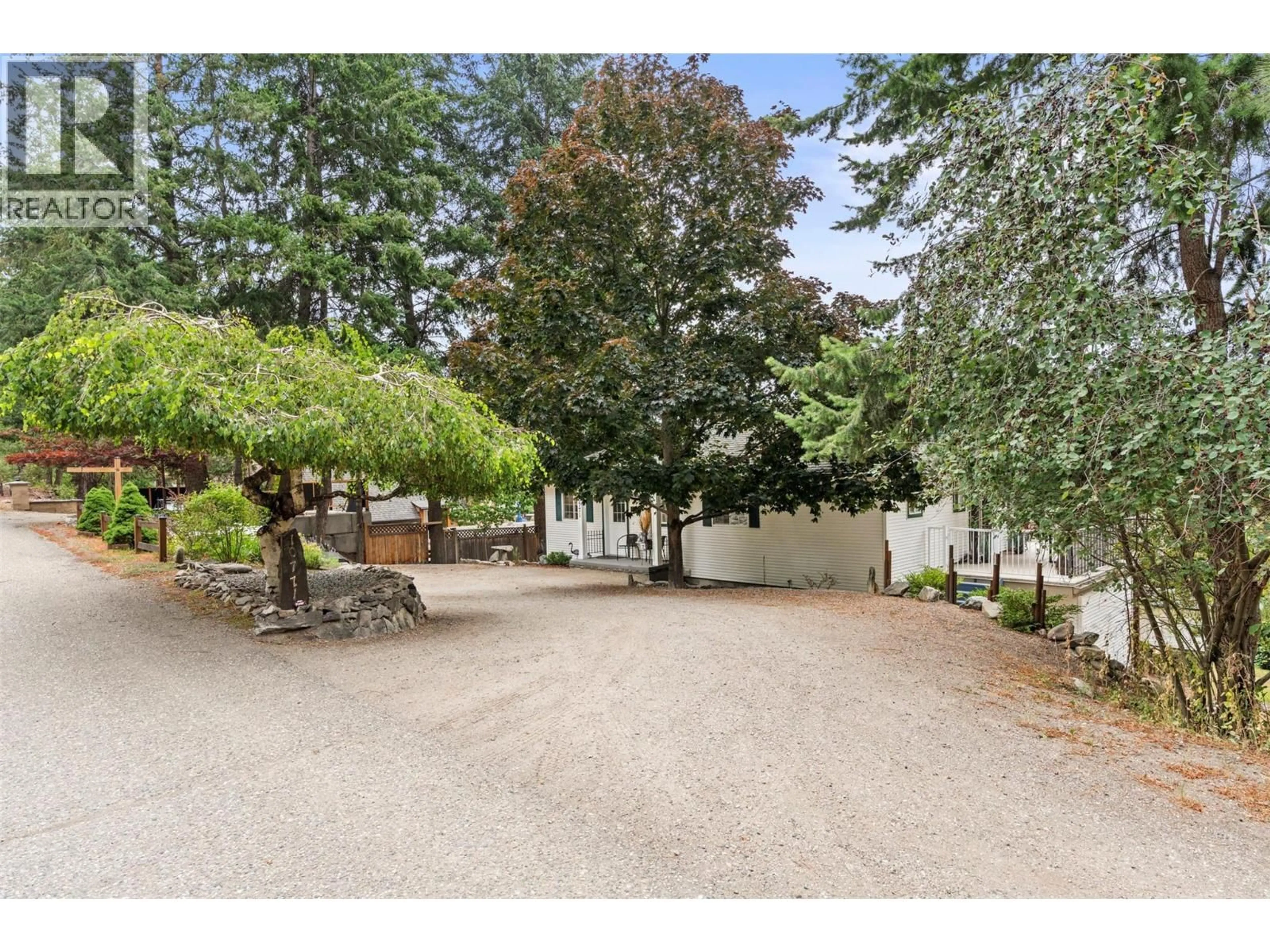 A pic from outside/outdoor area/front of a property/back of a property/a pic from drone, street for 10771 PINECREST ROAD, Vernon British Columbia V1H2C1