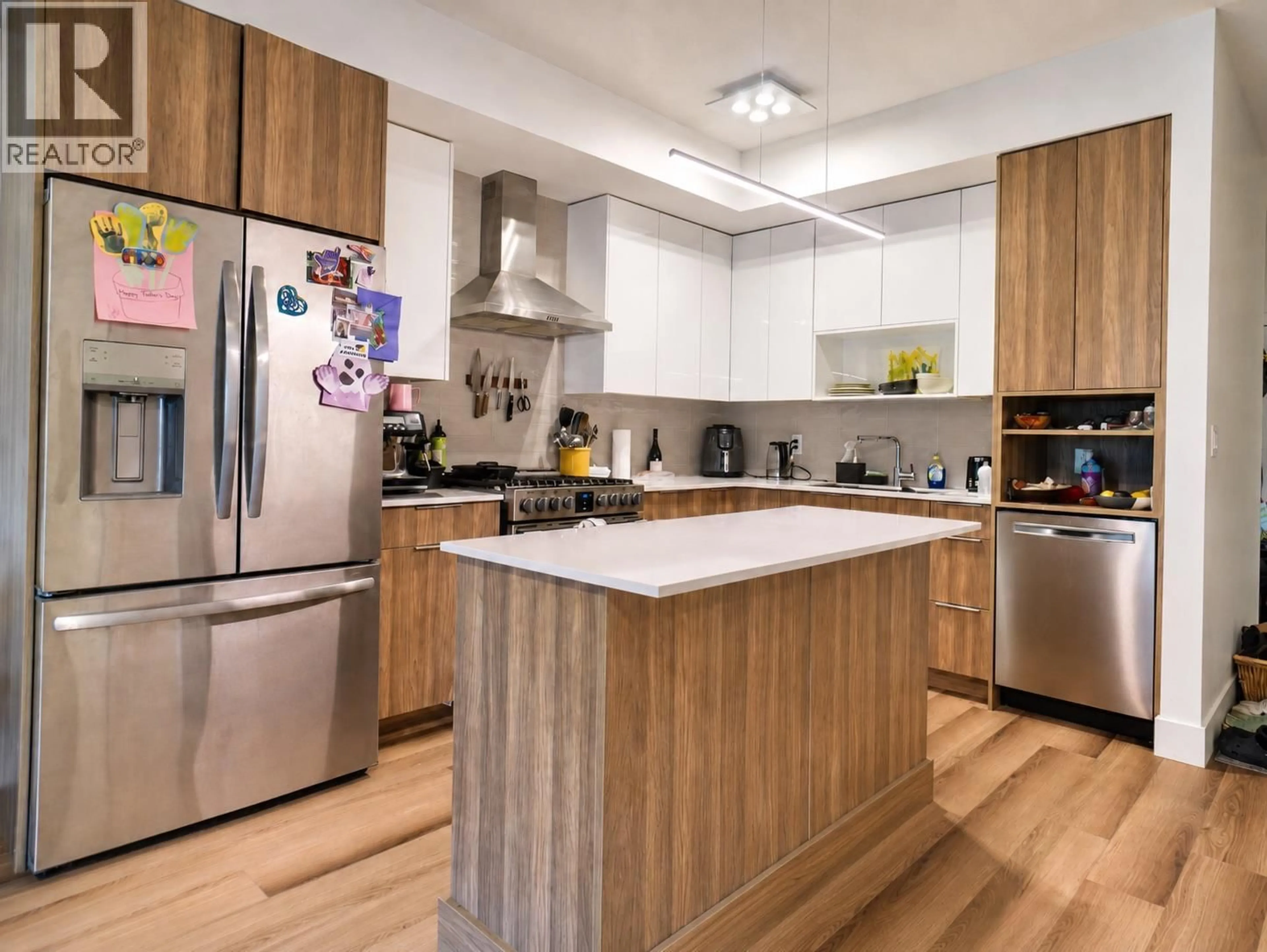 Contemporary kitchen, wood/laminate floor for 201 - 3642 MISSION SPRINGS DRIVE, Kelowna British Columbia V1W0E1
