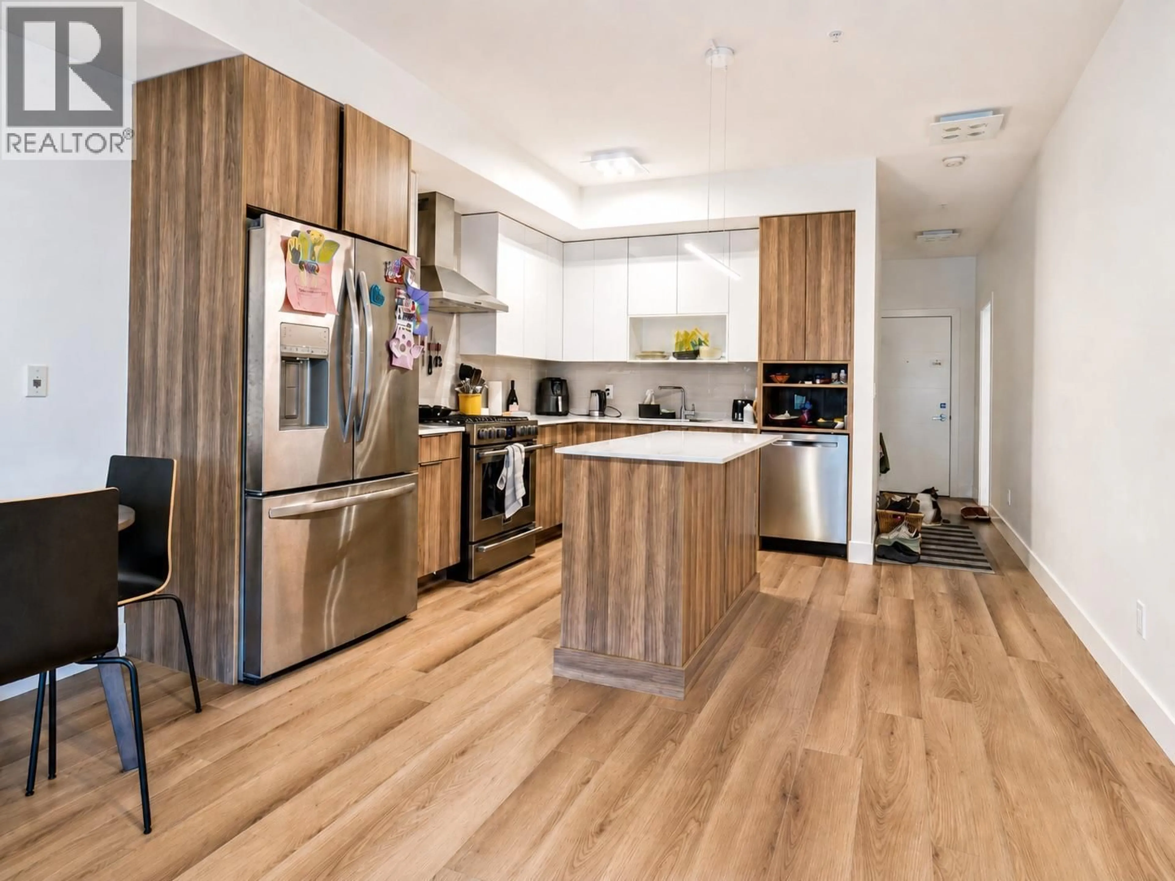 Contemporary kitchen, wood/laminate floor for 201 - 3642 MISSION SPRINGS DRIVE, Kelowna British Columbia V1W0E1