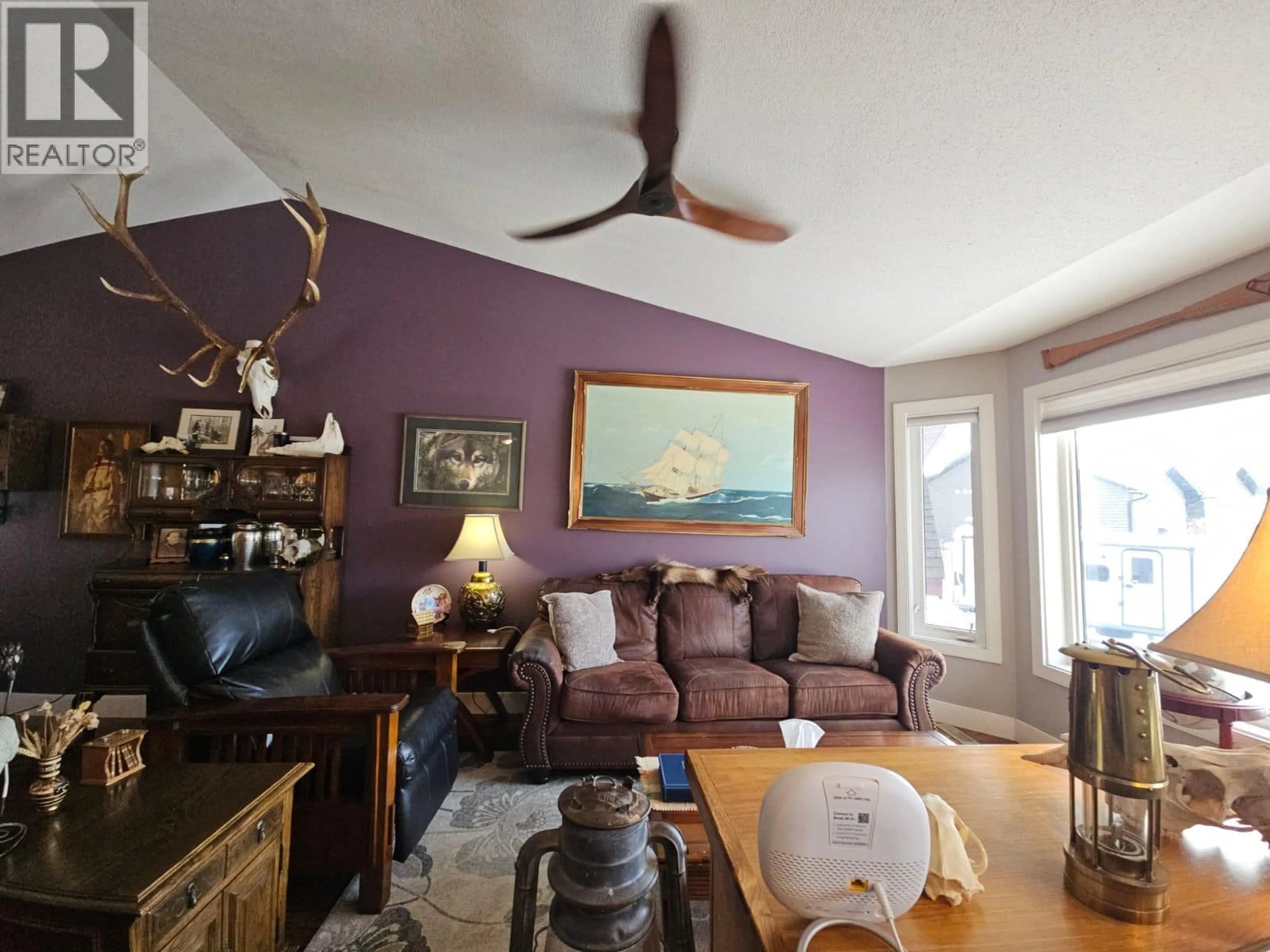 Living room with furniture, wood/laminate floor for 84 WOLVERINE AVENUE, Tumbler Ridge British Columbia V0C2W0